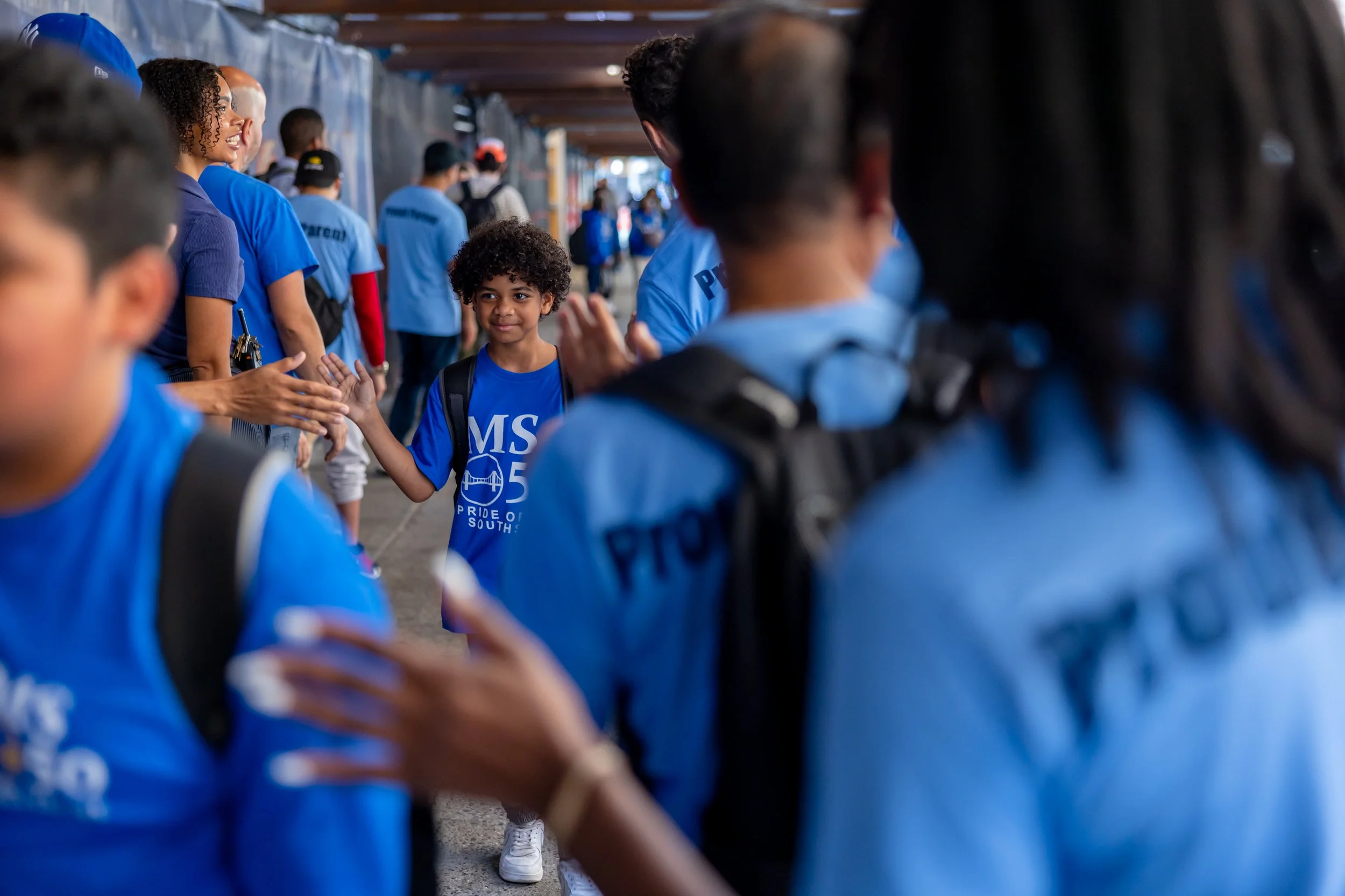 Students get high fives from parents