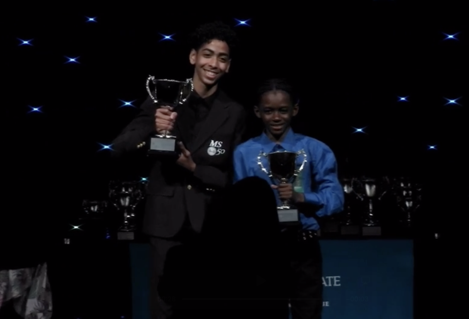students hold national debate trophies
