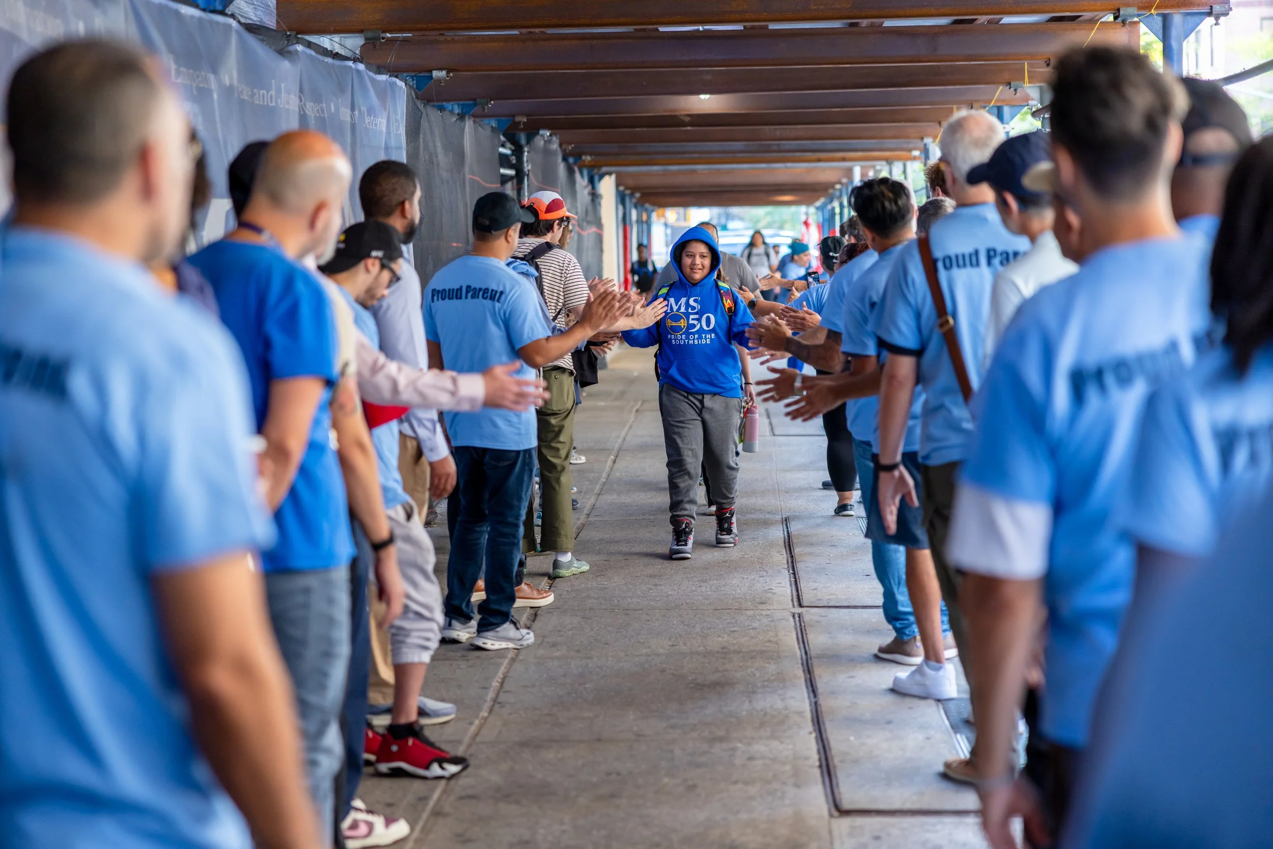 Students get high fives from parents