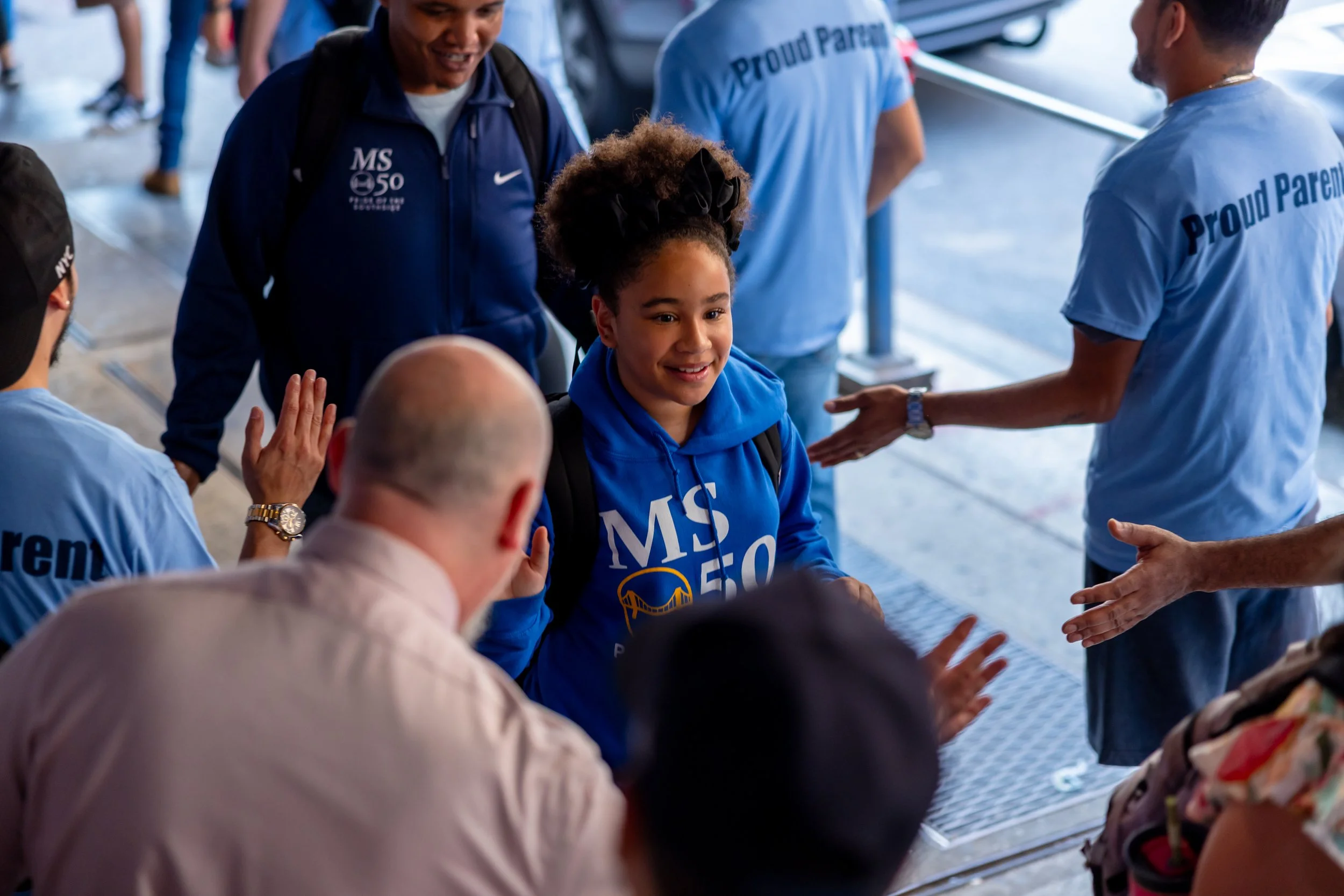 Students get high fives from parents