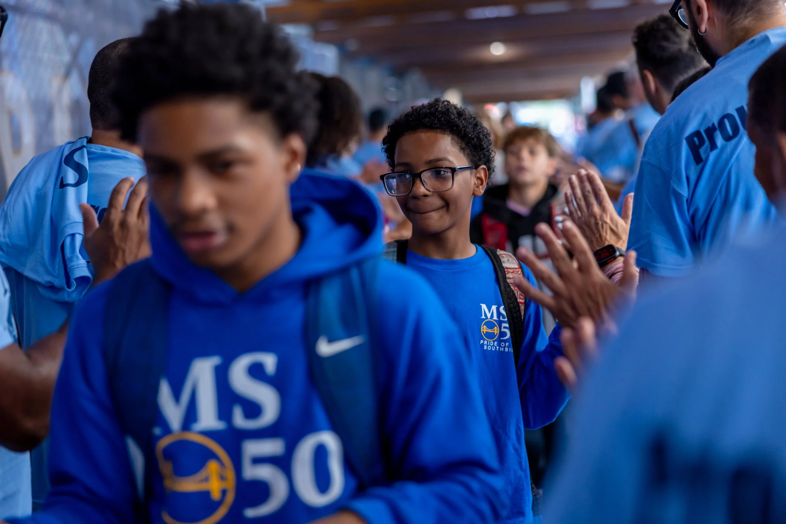 Students get high fives from parents