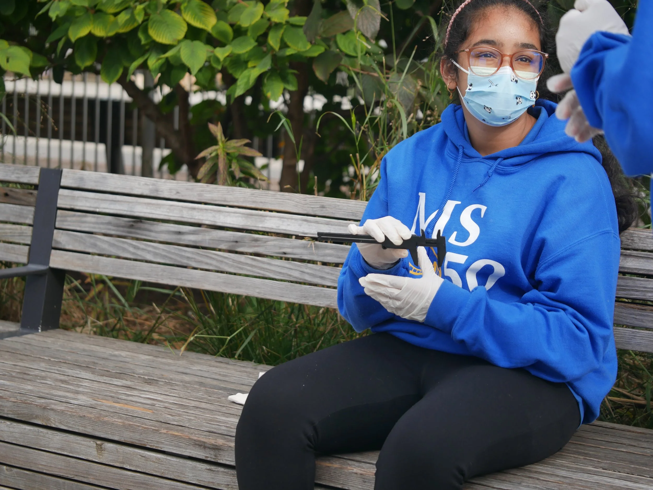 student measures an oyster