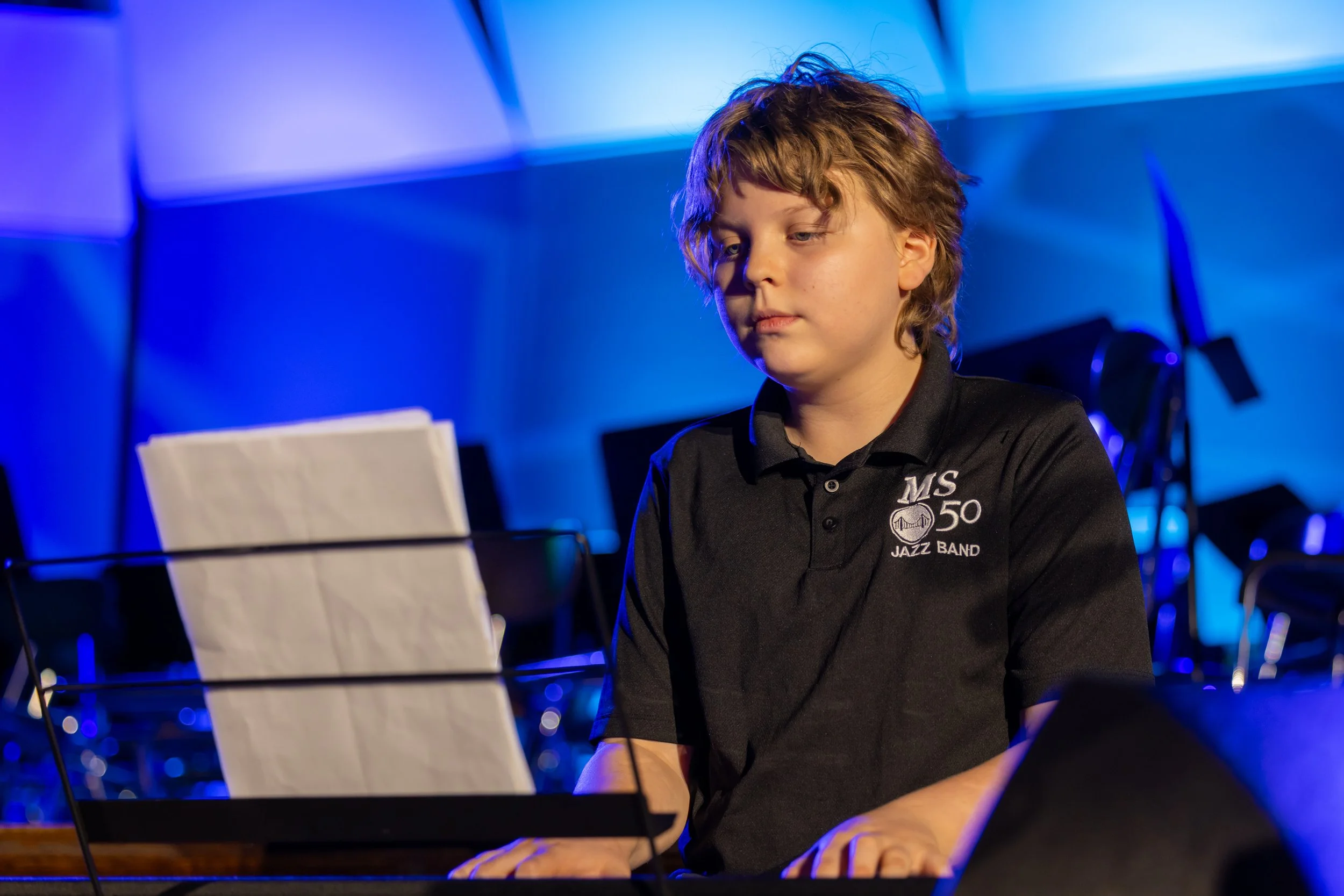 middle school students perform in band concert