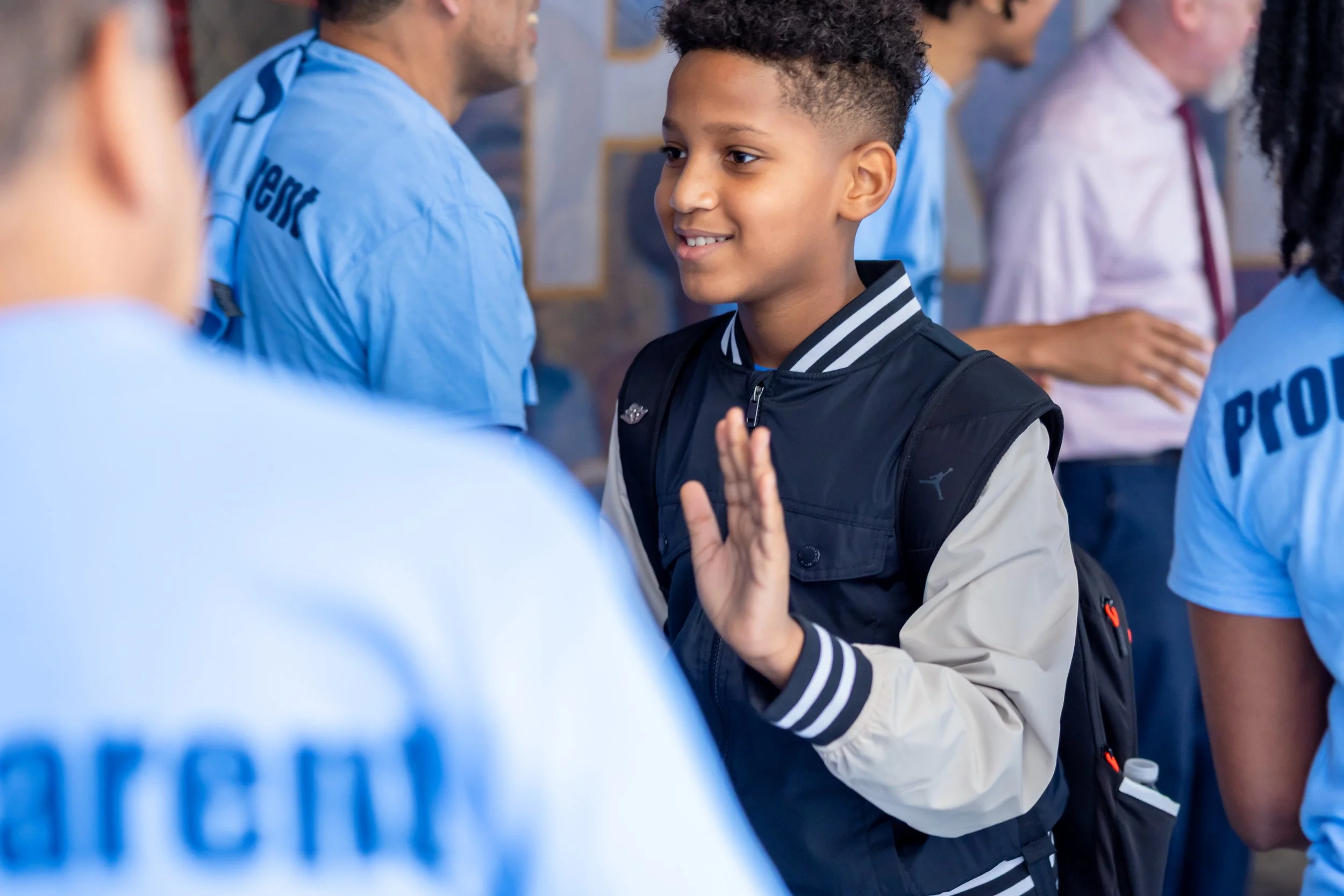 Students get high fives from parents