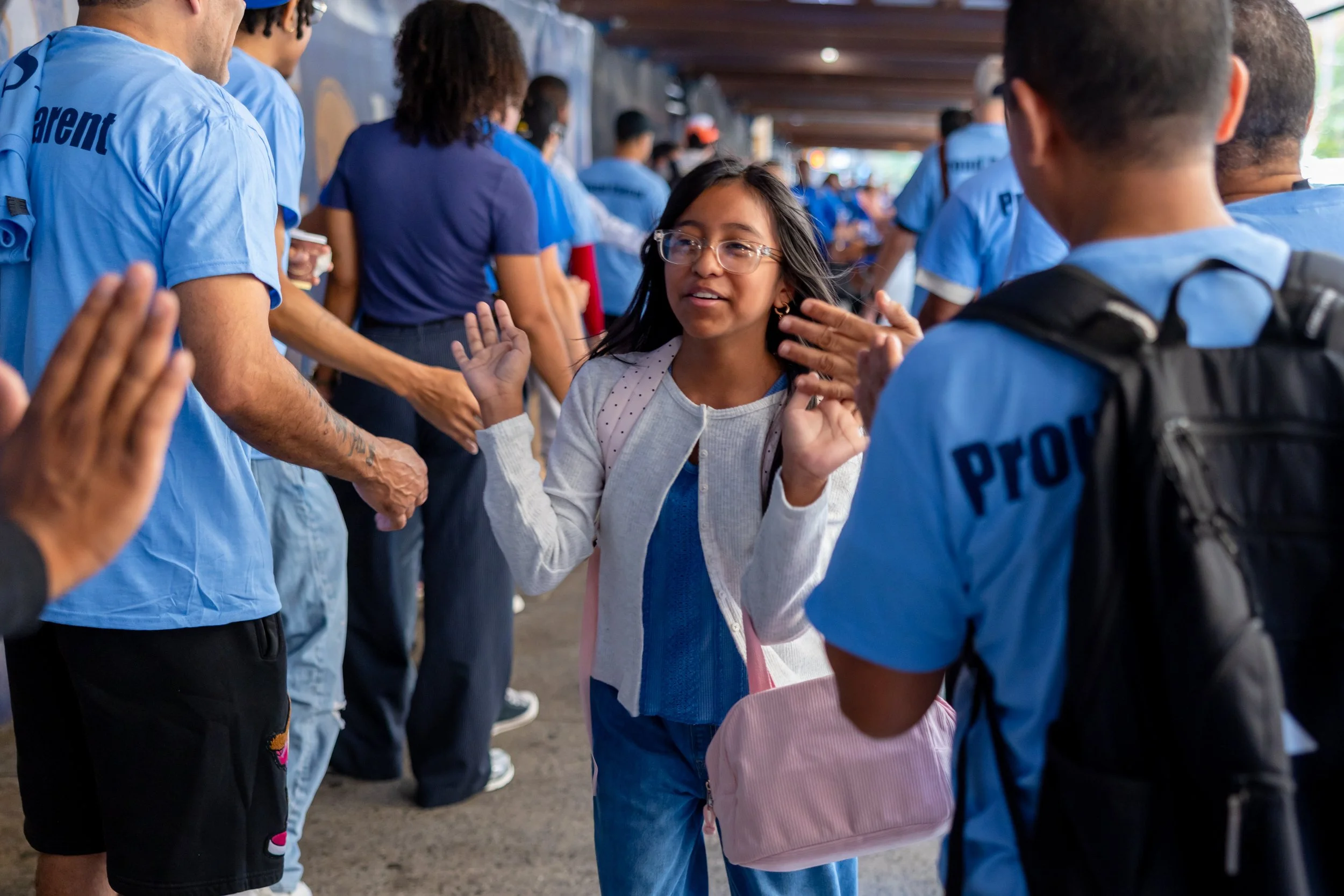 Students get high fives from parents