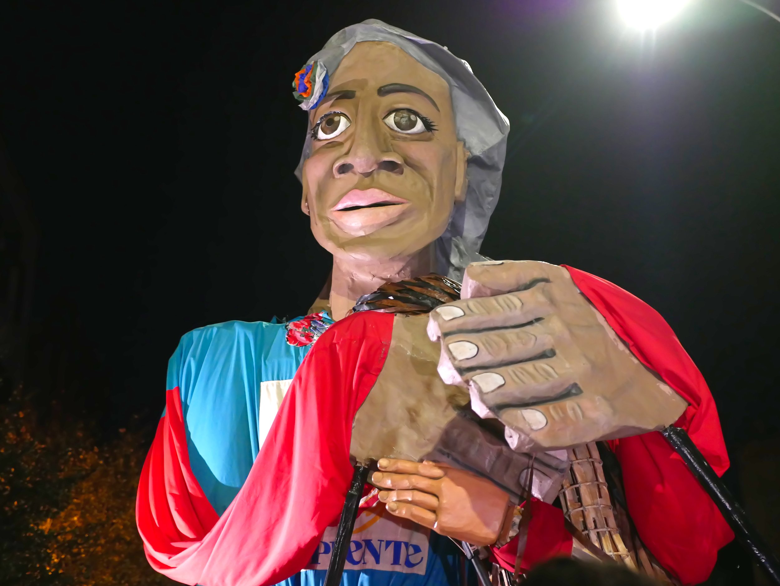 madre tierra wraps her arms around little Amal 