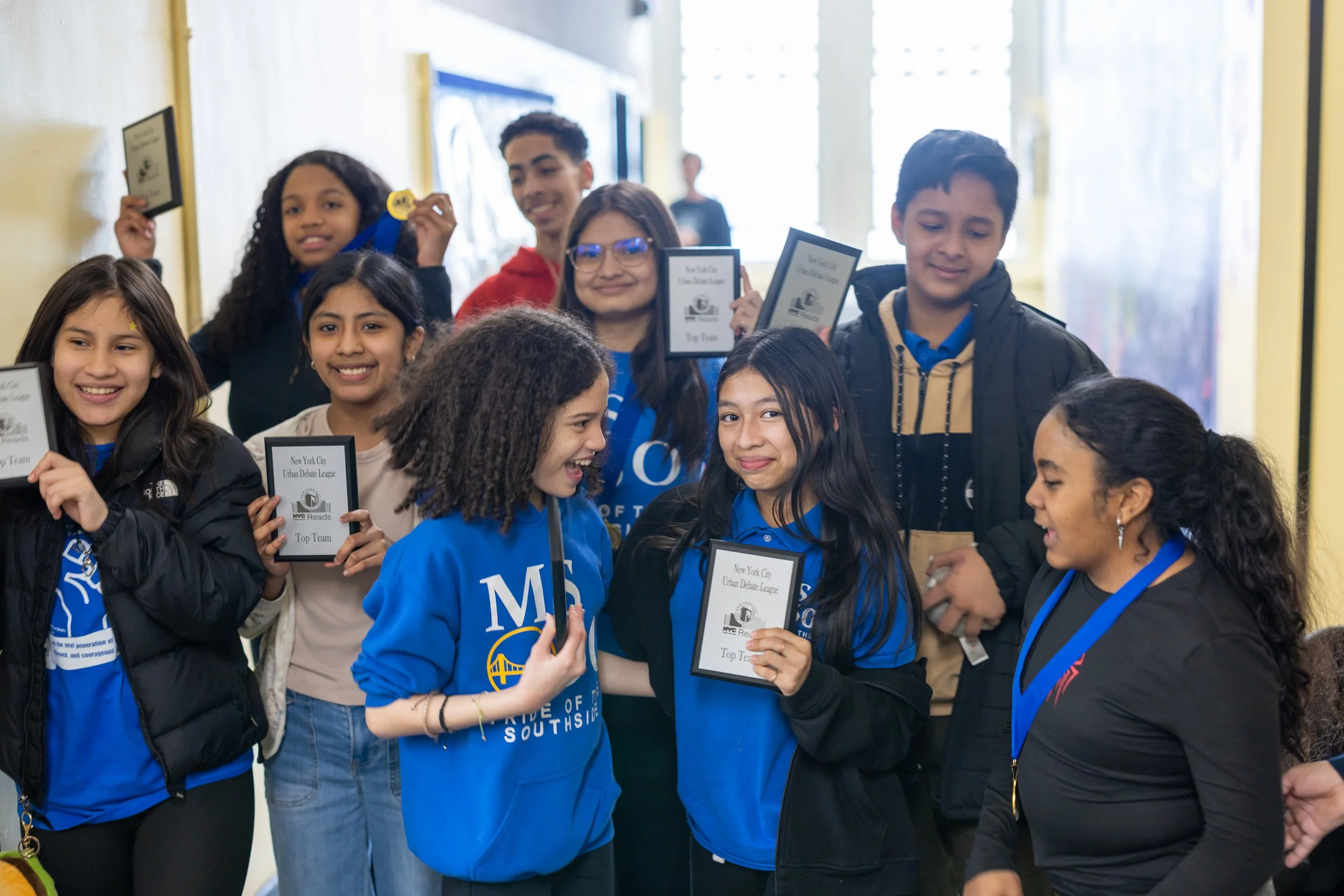 Debaters celebrate their wins