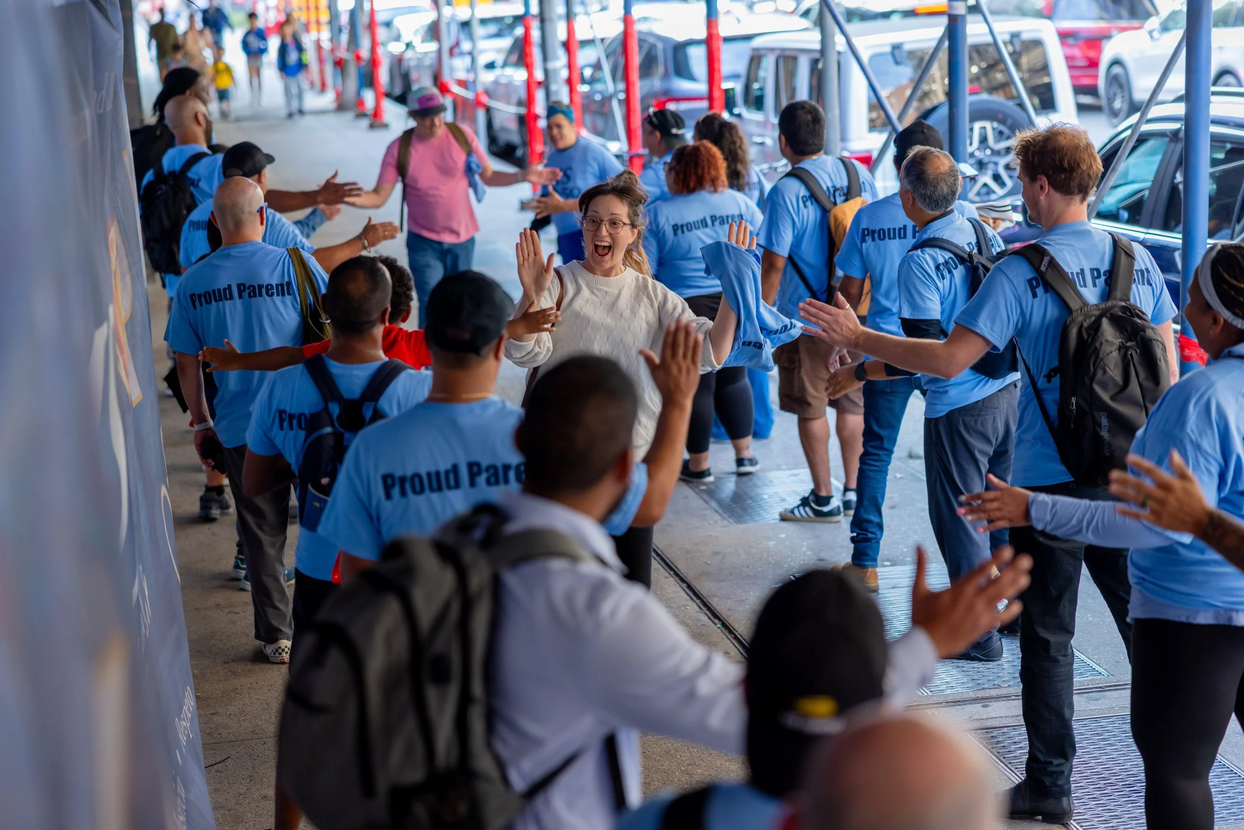 Students get high fives from parents