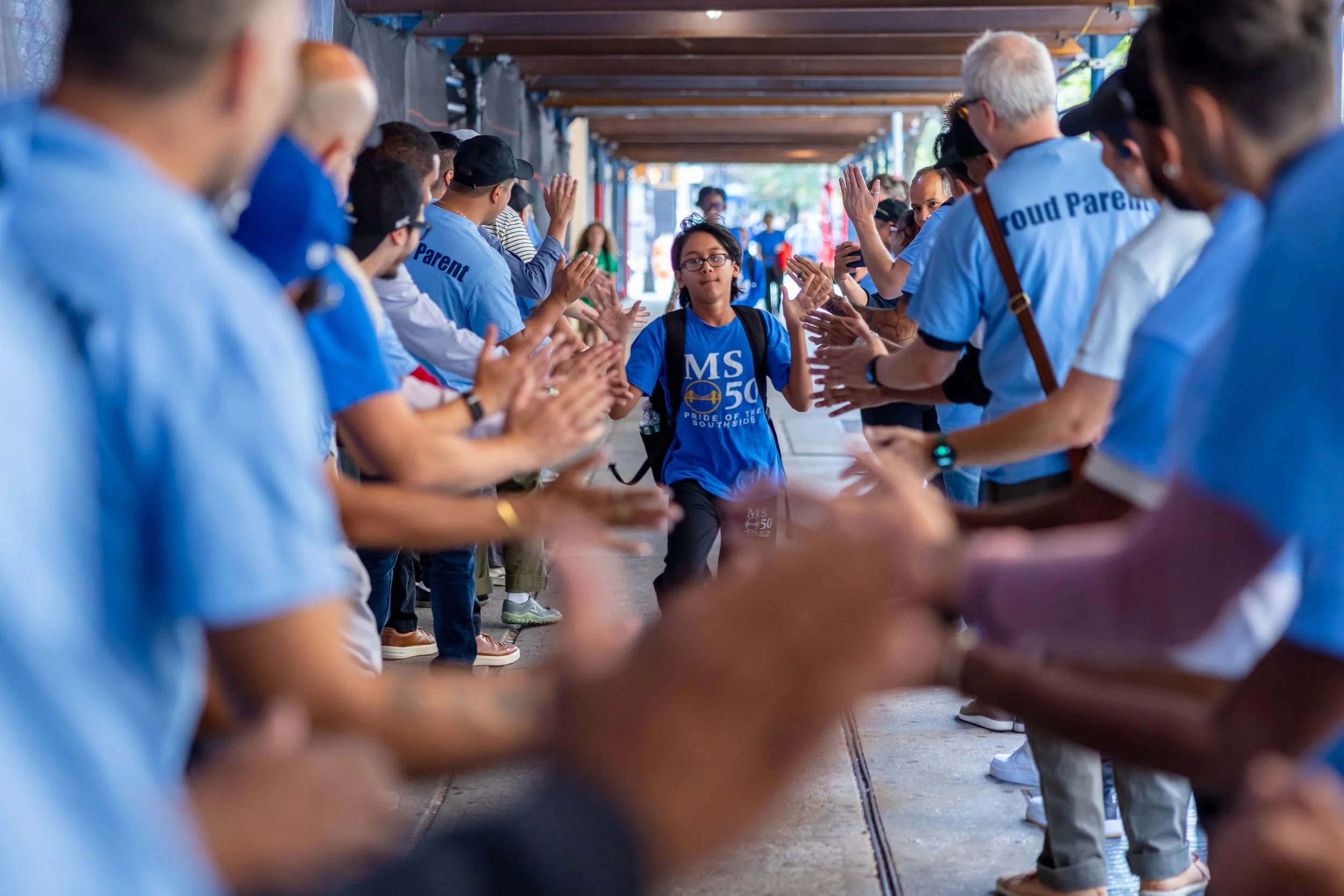 Students get high fives from parents