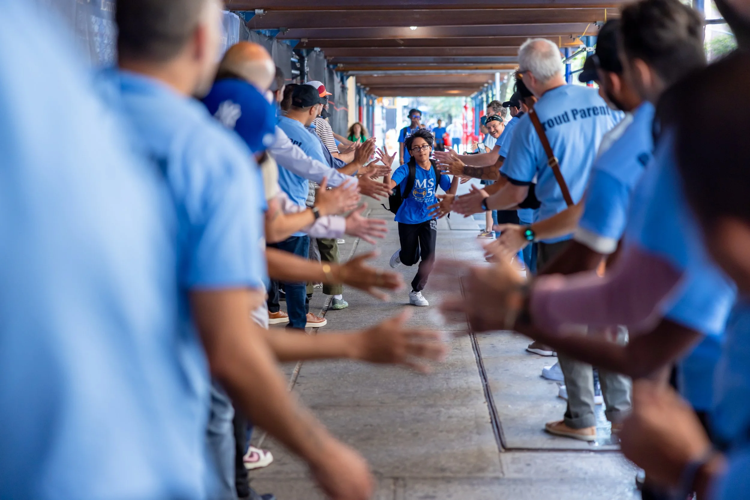Students get high fives from parents