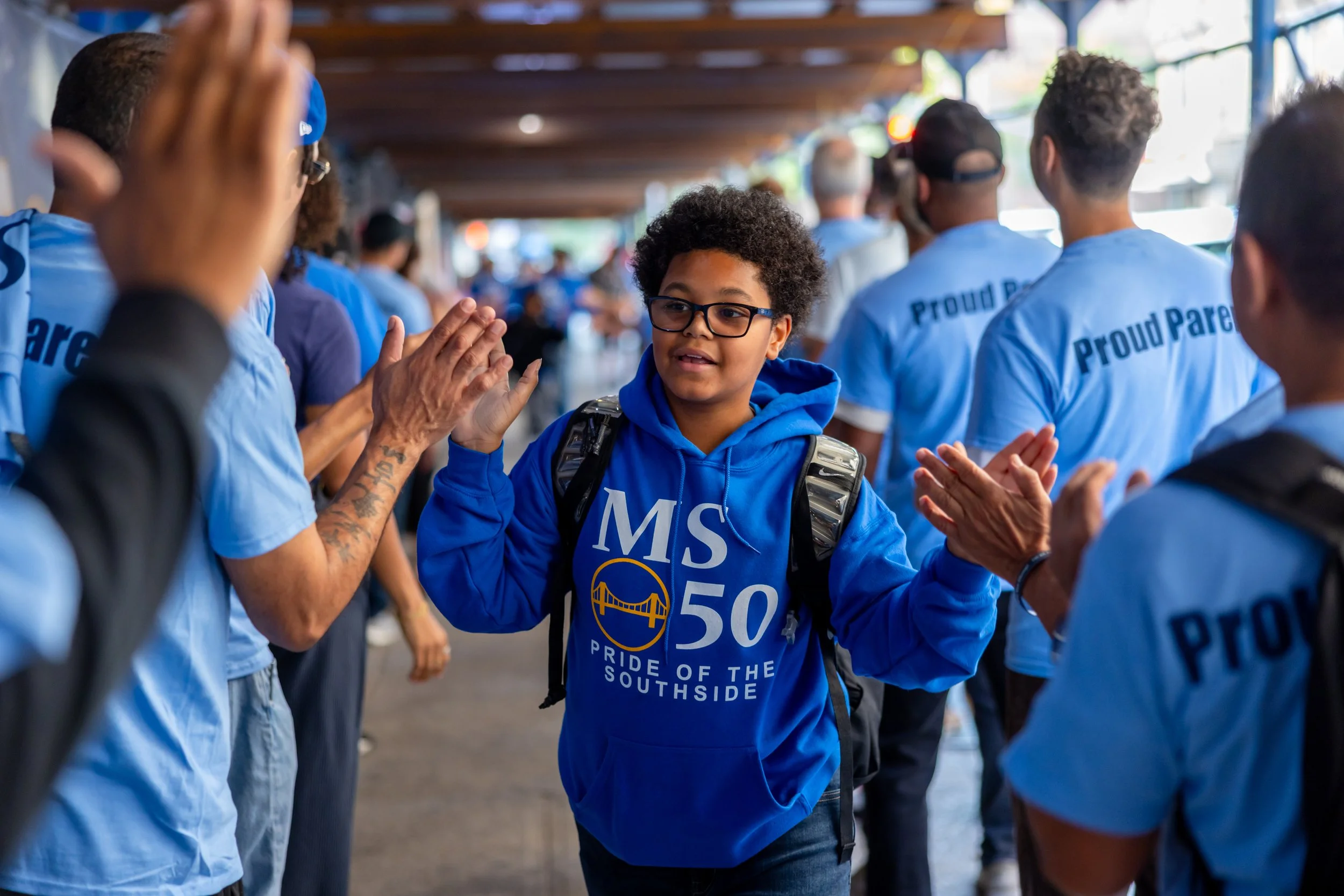 Students get high fives from parents