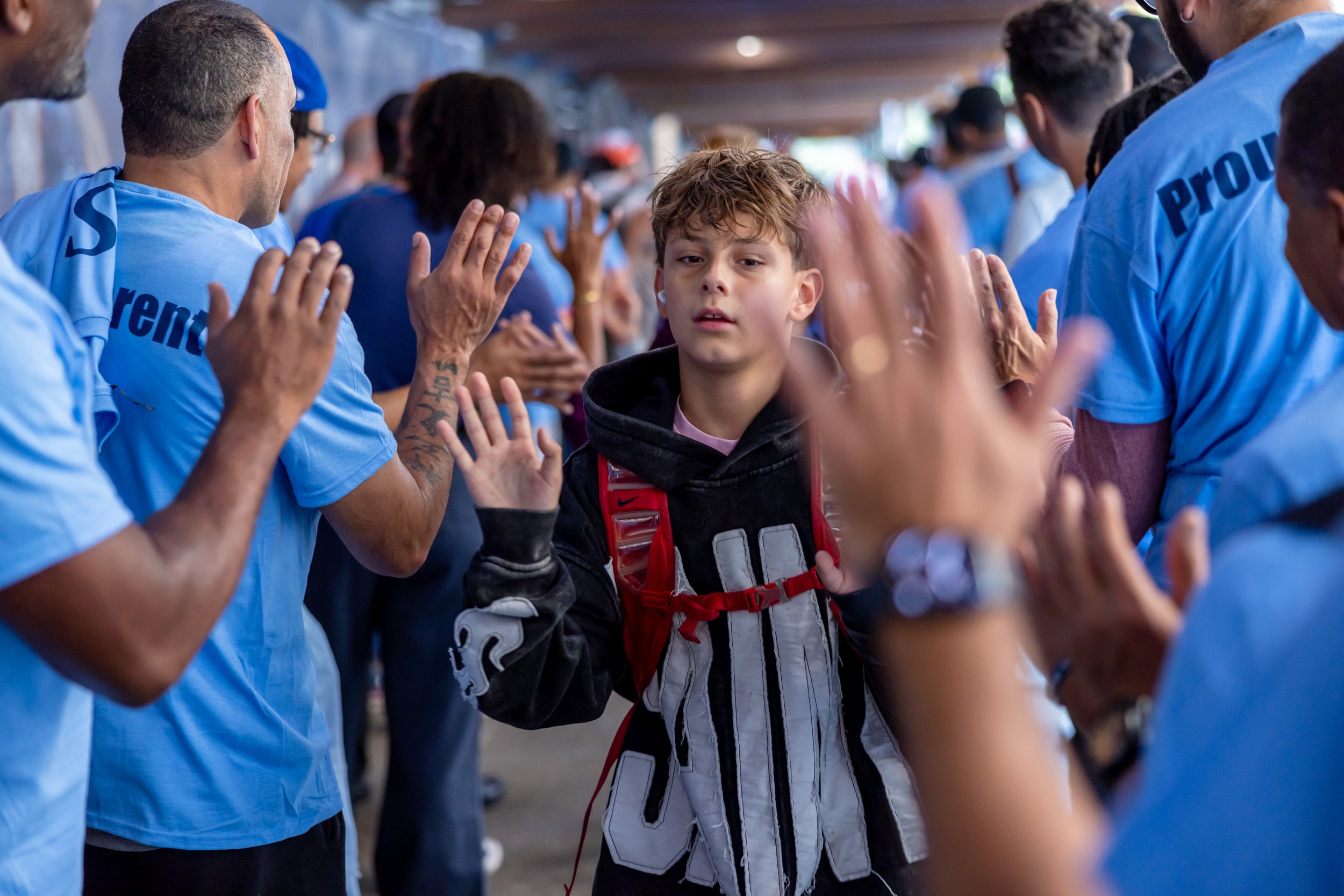 Students get high fives from parents