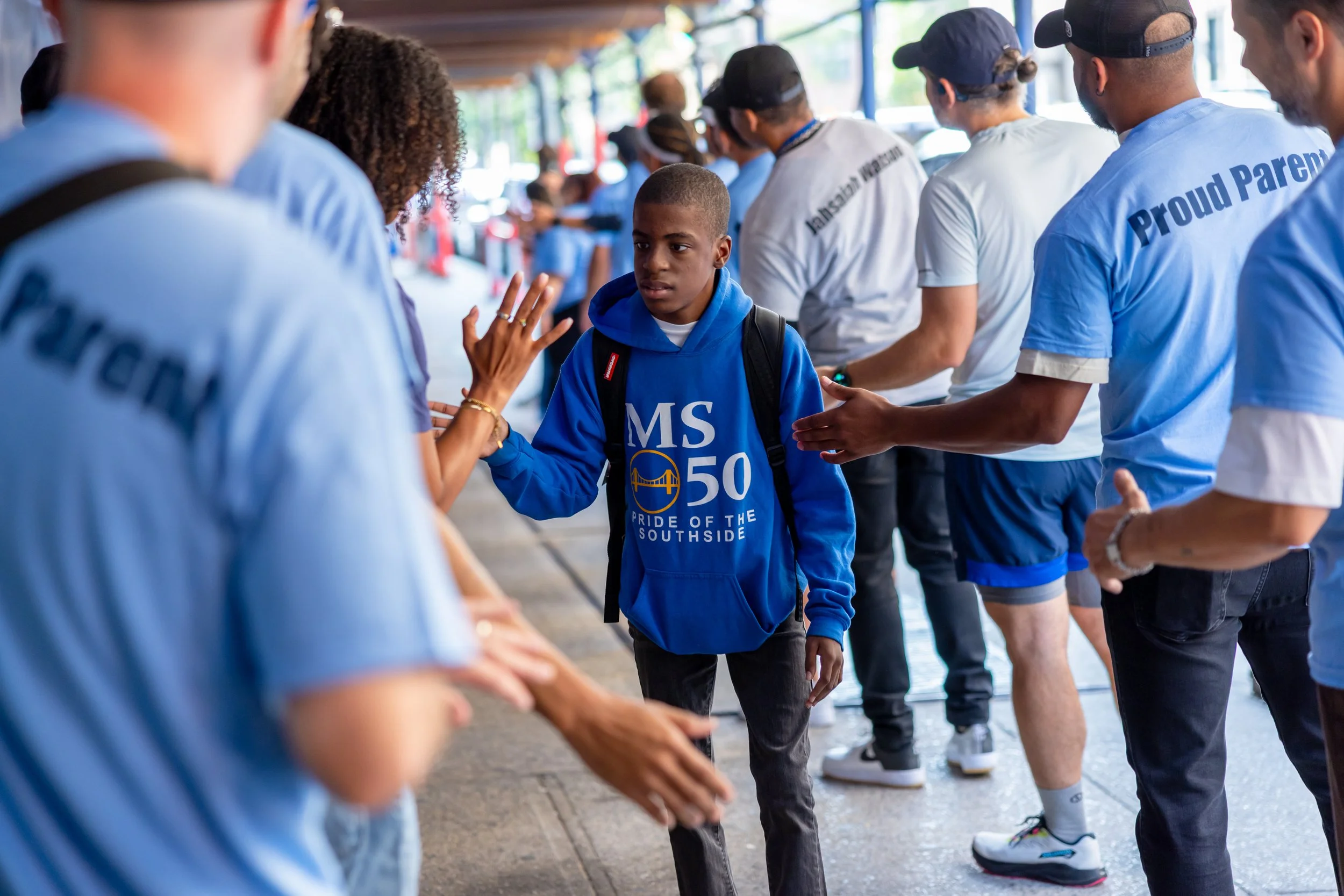 Students get high fives from parents