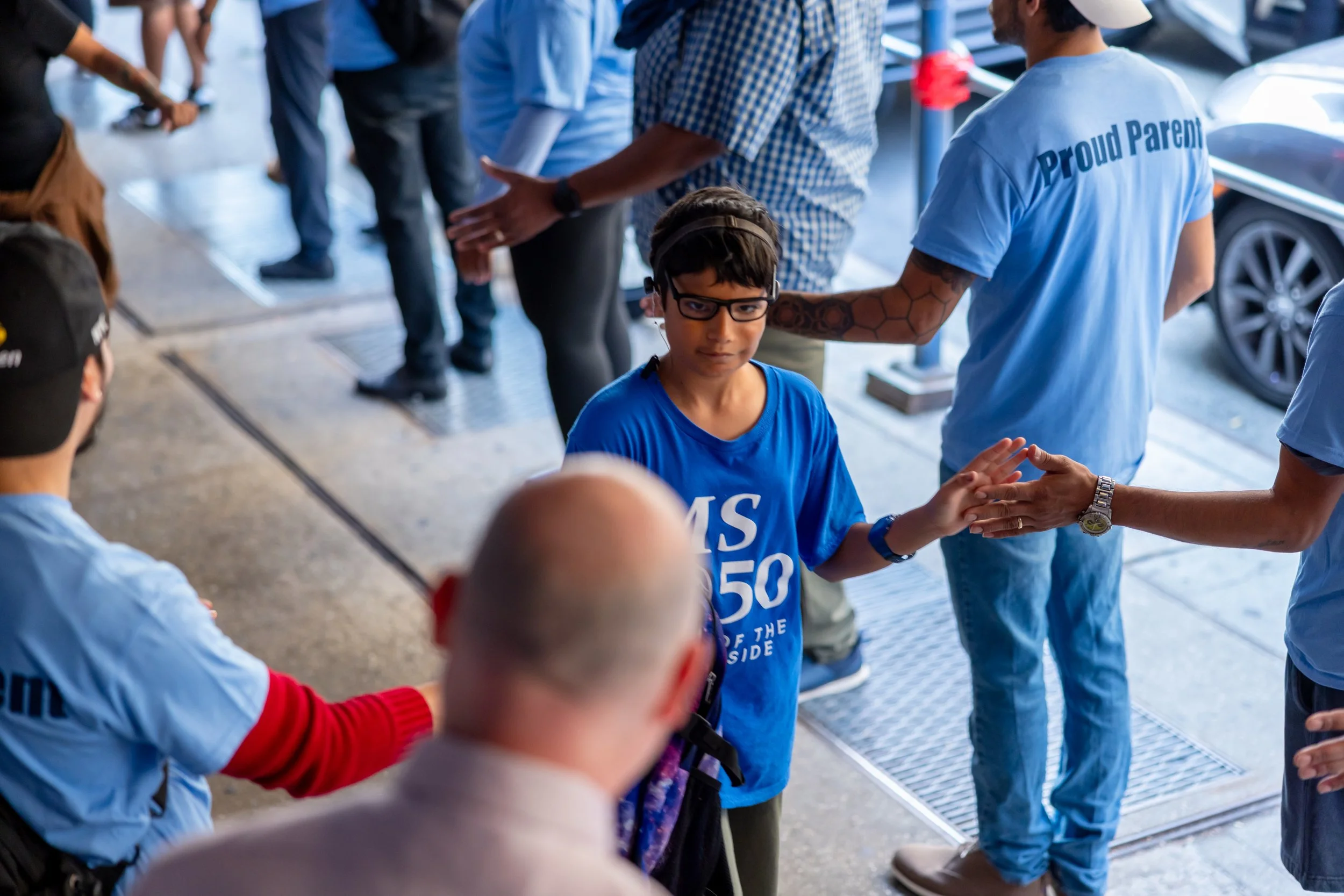 Students get high fives from parents