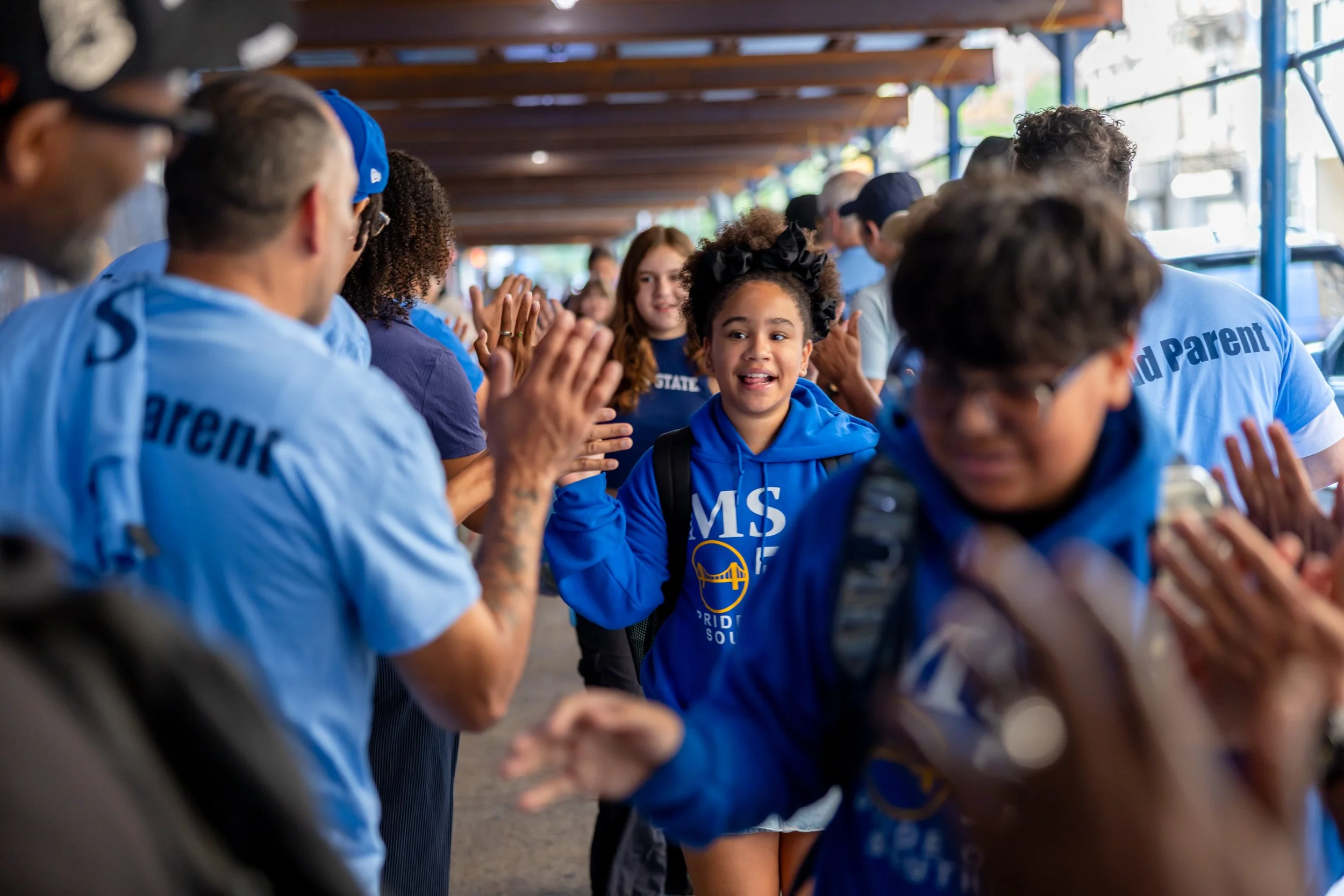 Students get high fives from parents