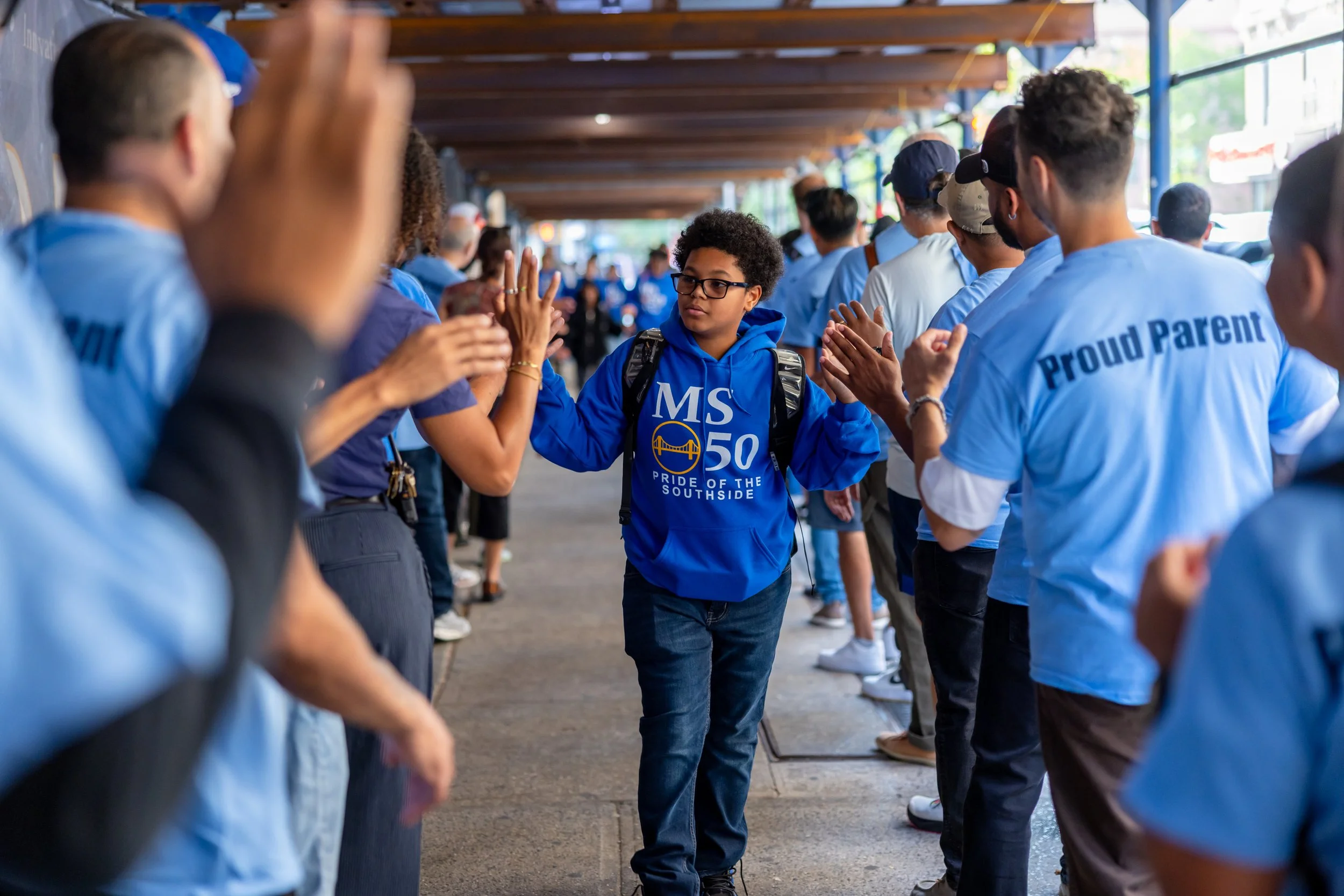 Students get high fives from parents