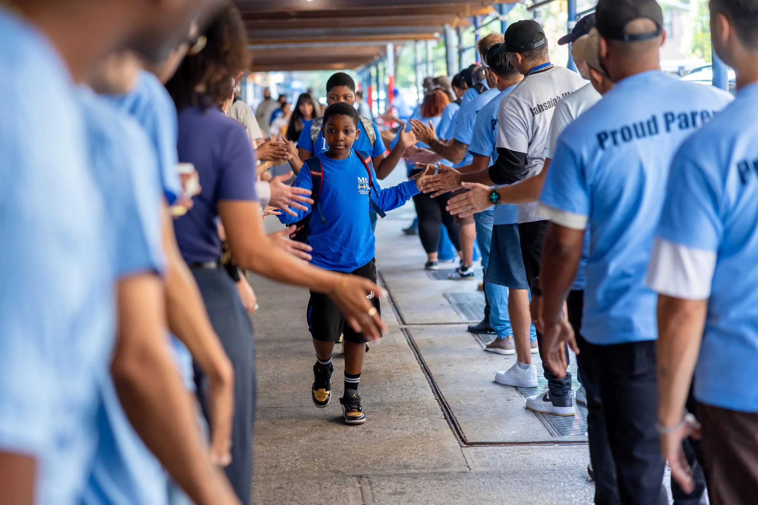 Students get high fives from parents