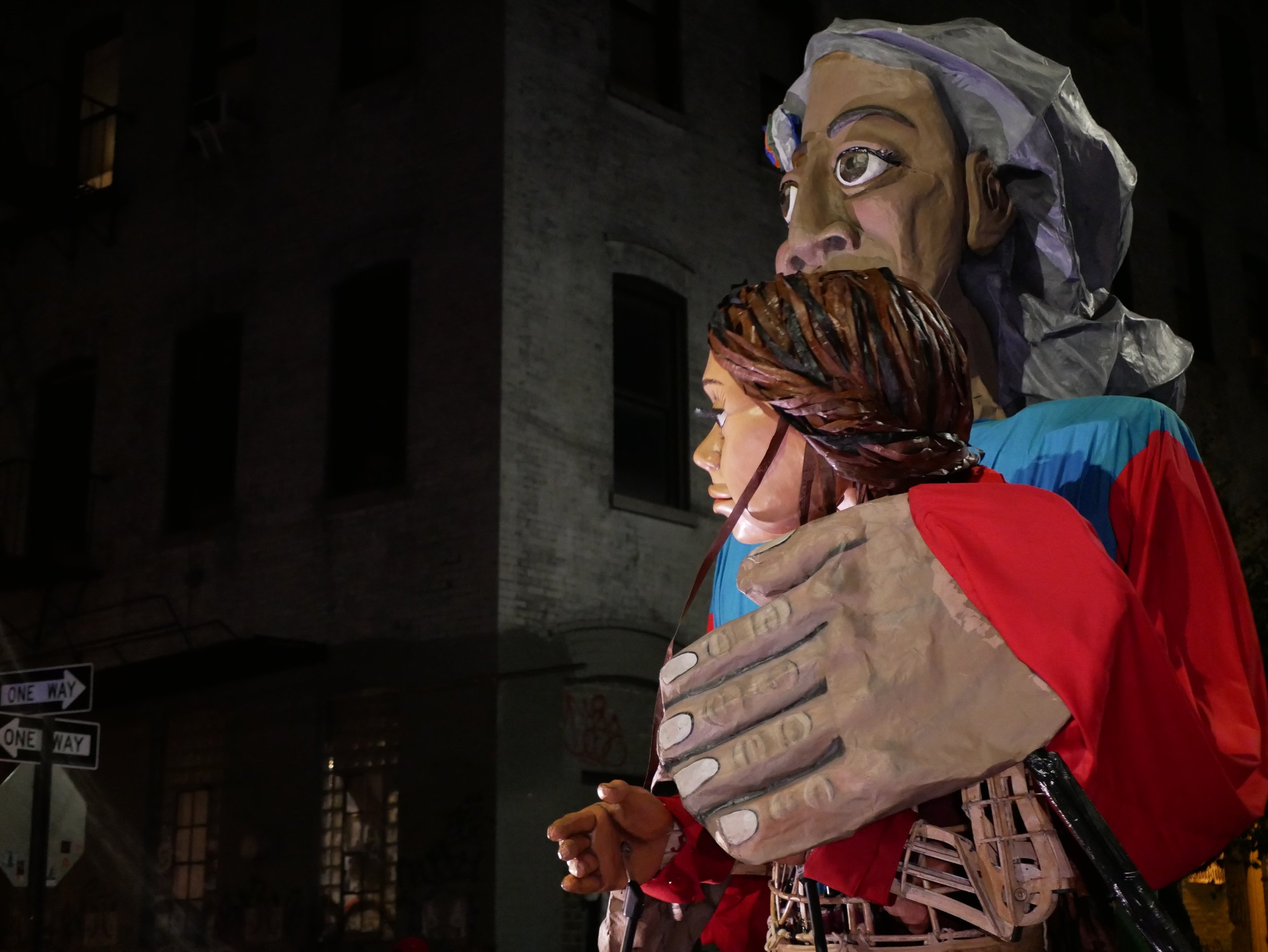 madre tierra with an arm around little Amal