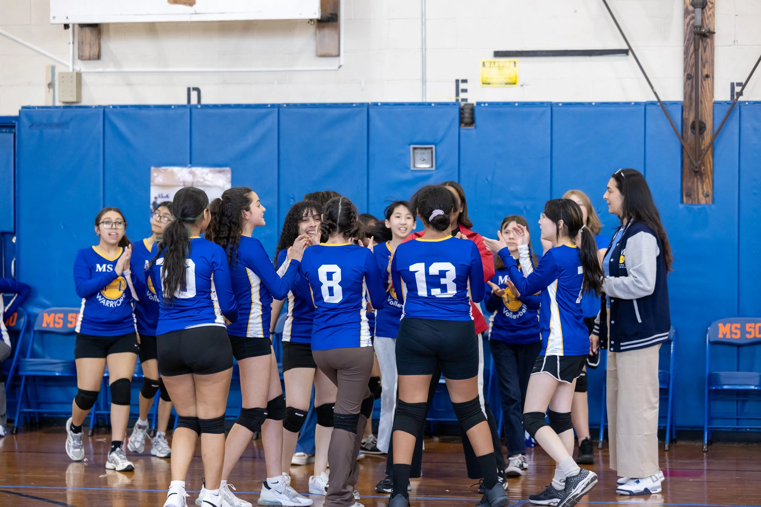 MS 50 students playing volleyball