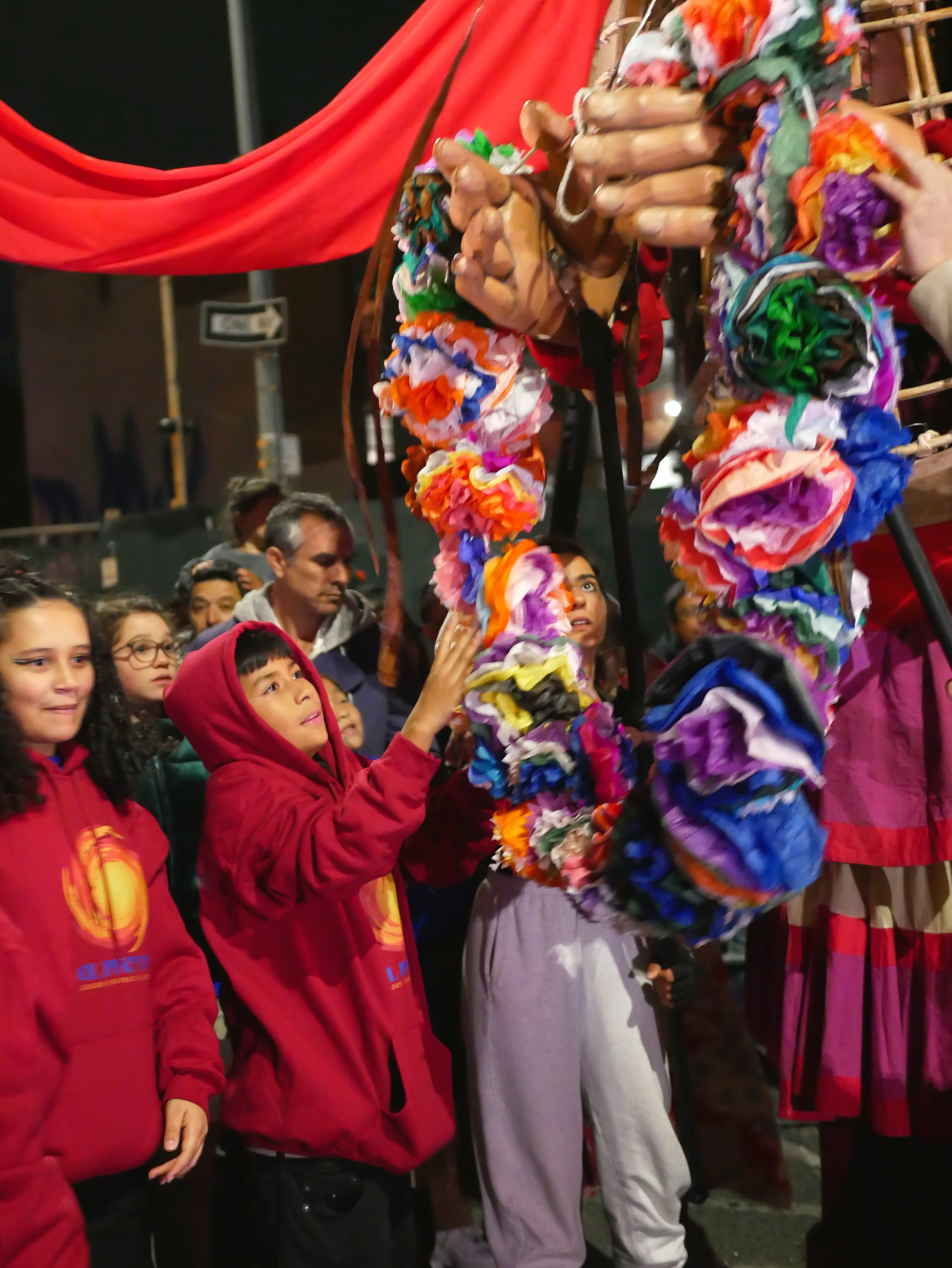 Students present Amal with a lei of flowers