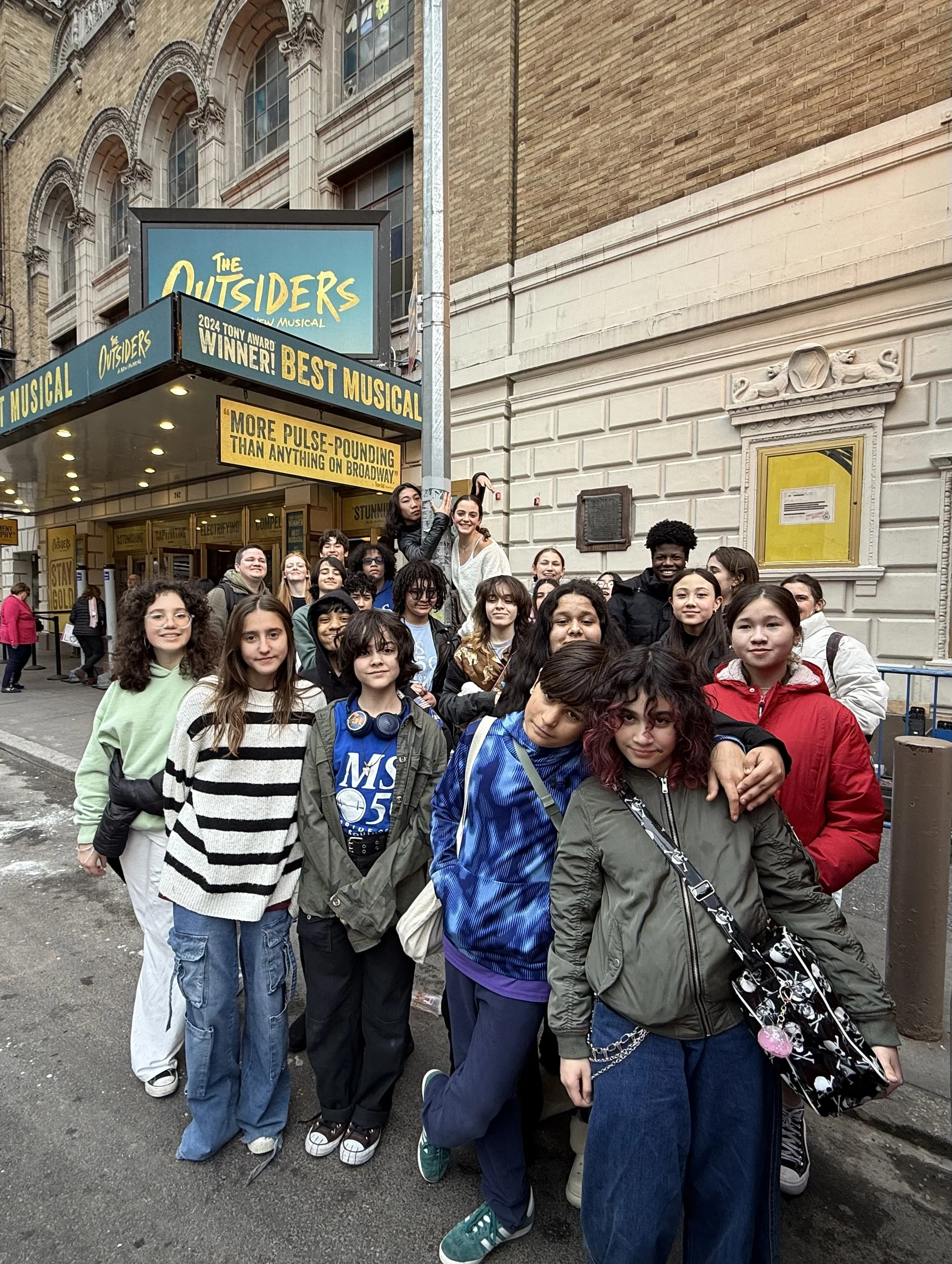 students outside a performance of "The Outsiders"