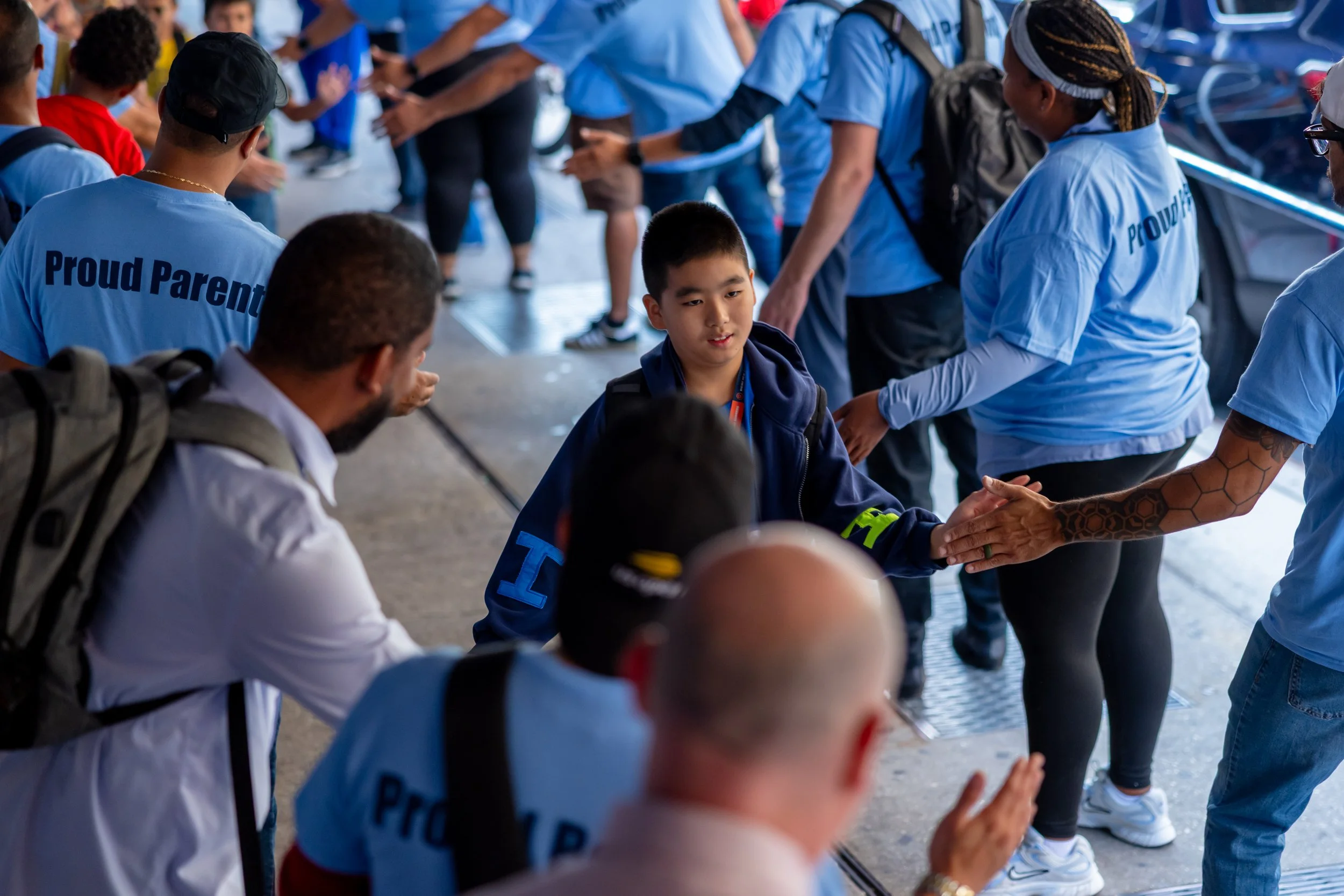 Students get high fives from parents
