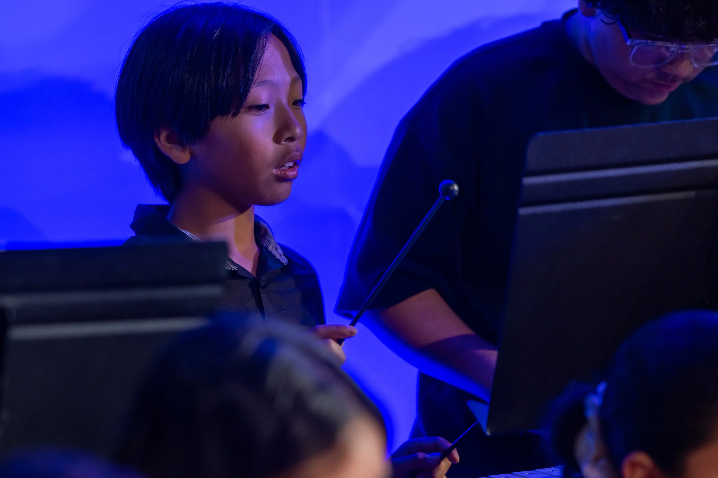 middle school students perform in band concert