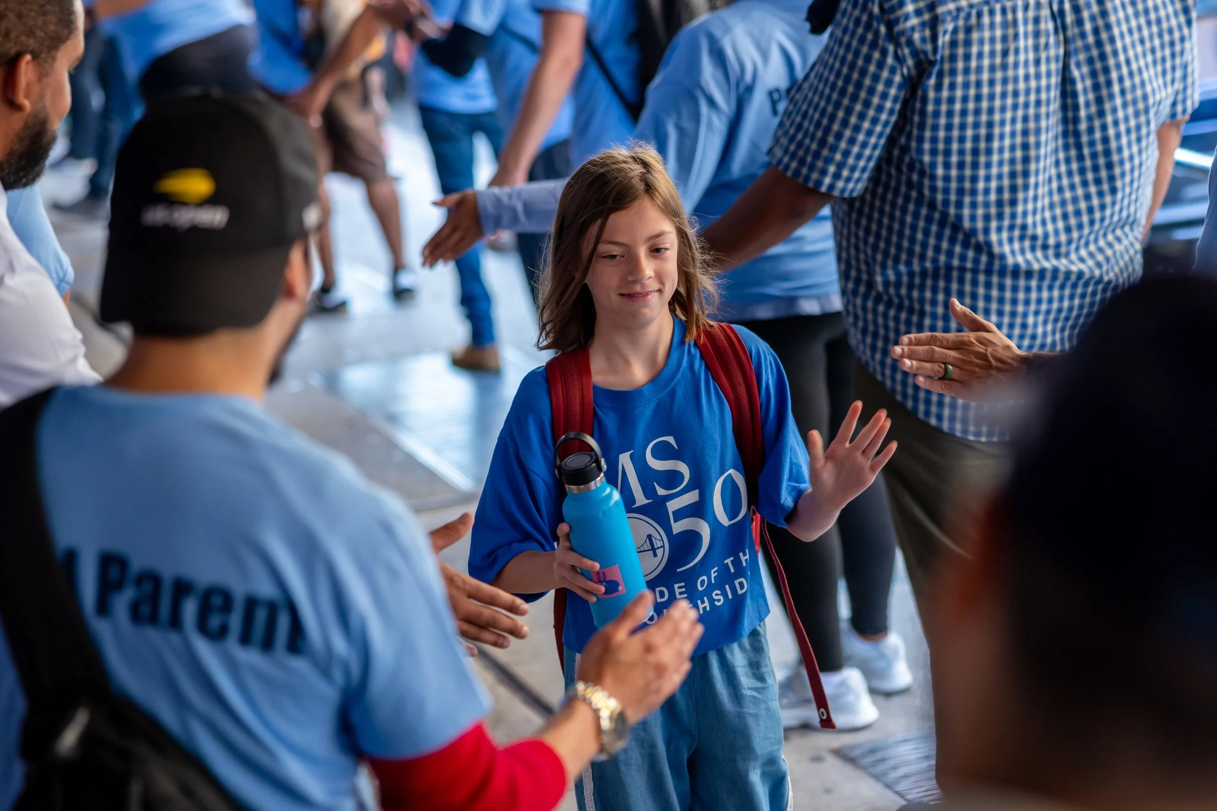 Students get high fives from parents