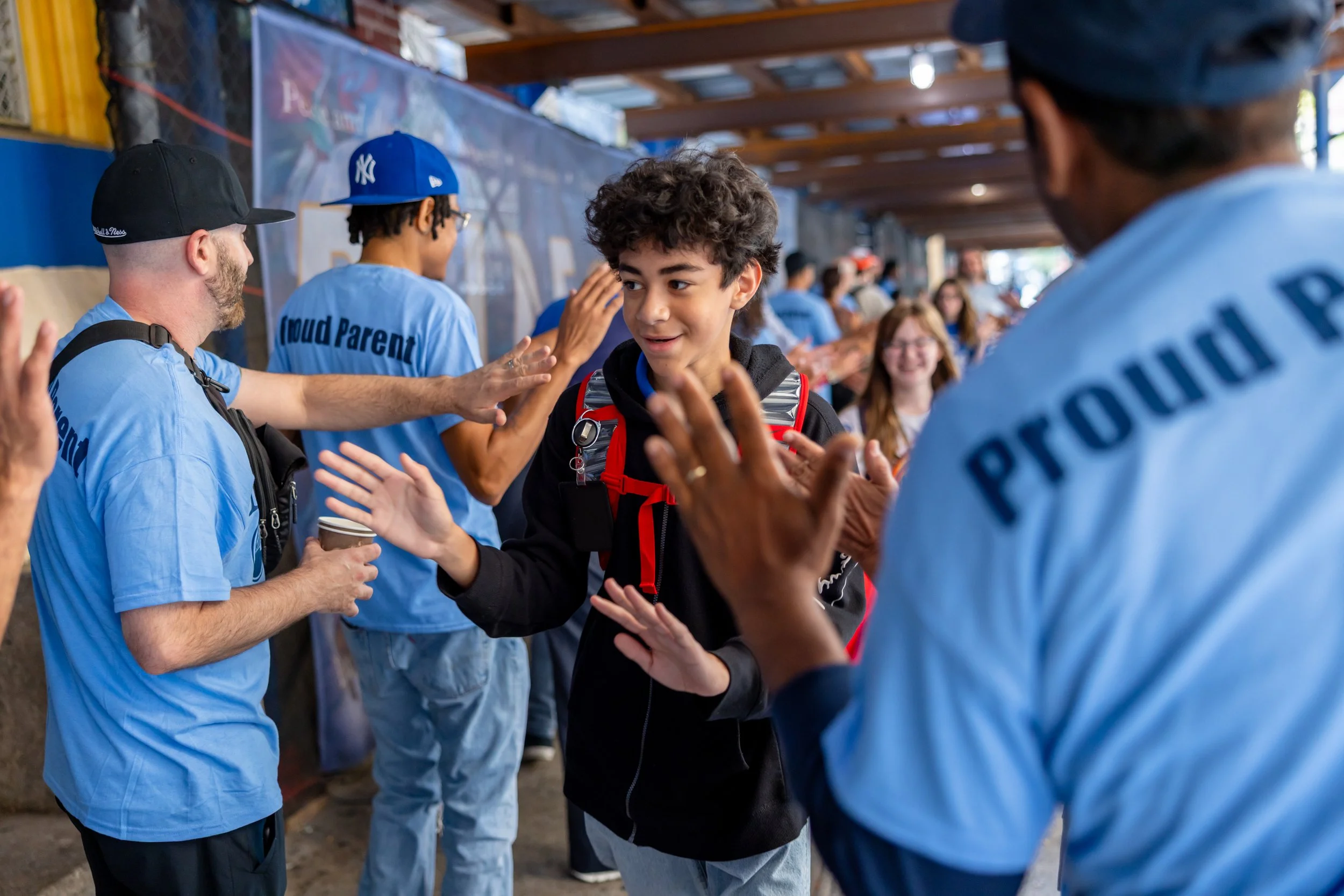 Students get high fives from parents