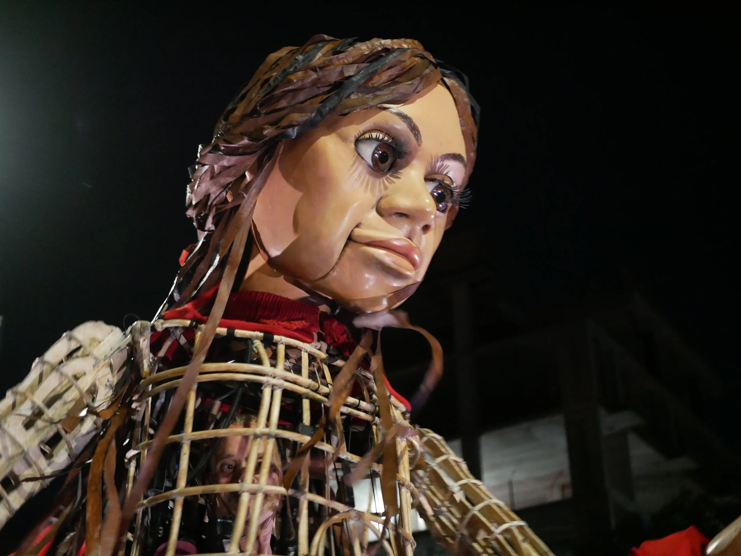 little Amal looks on