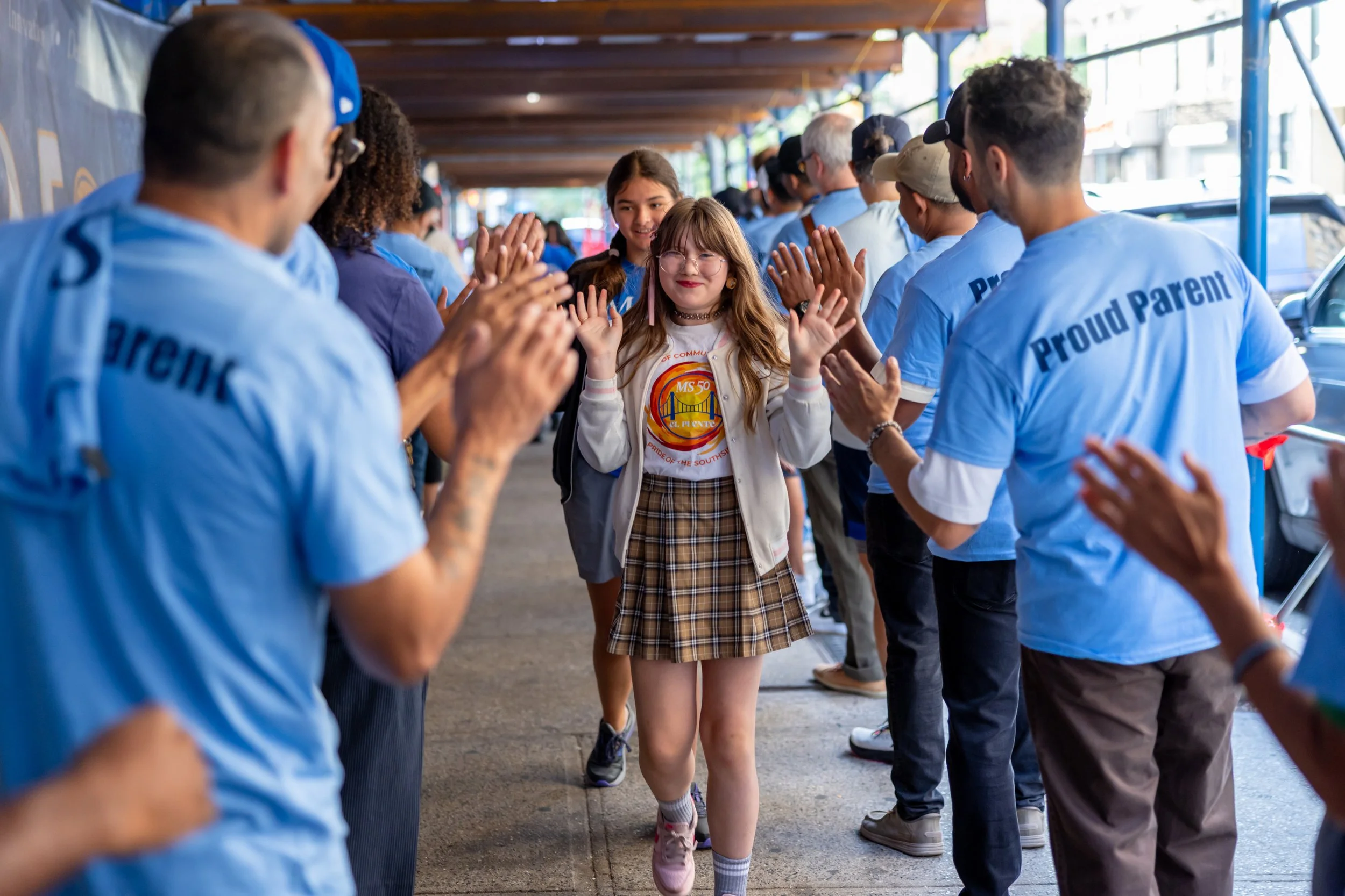 Students get high fives from parents