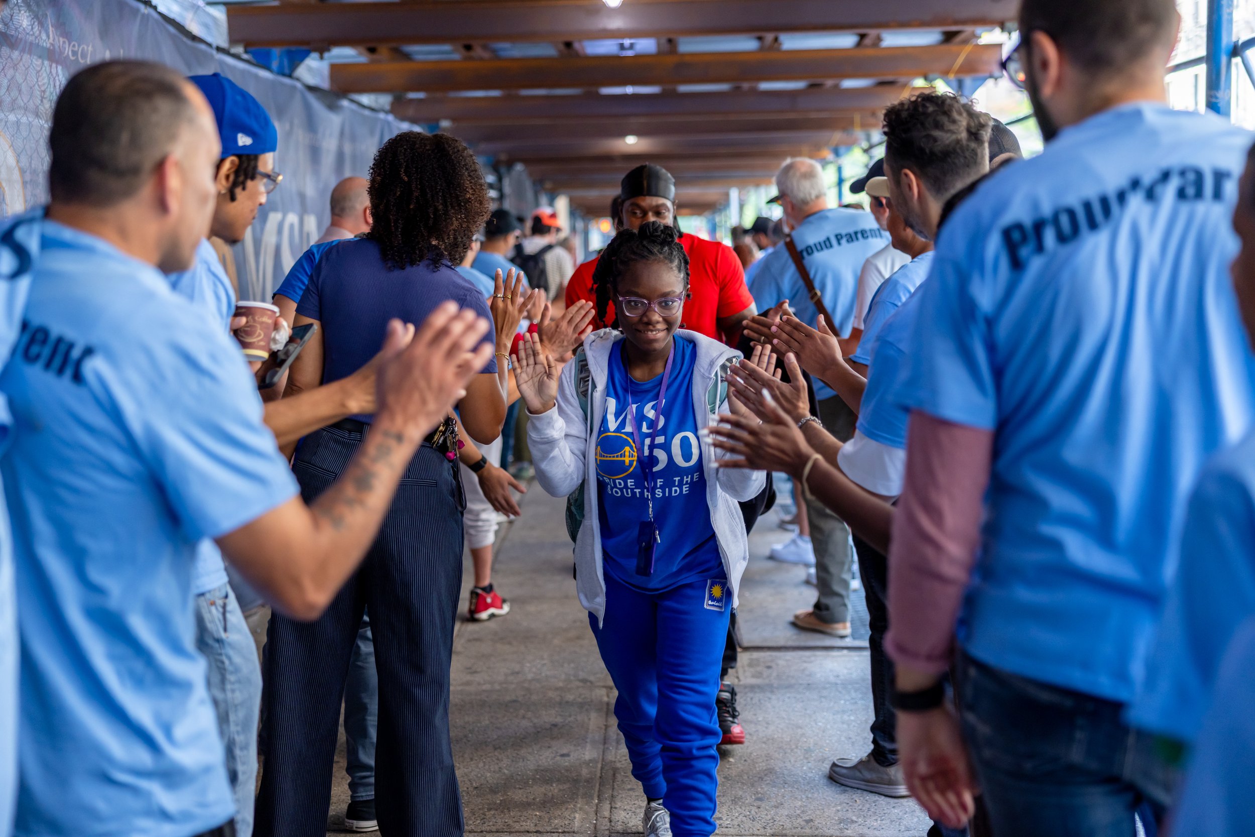 Students get high fives from parents