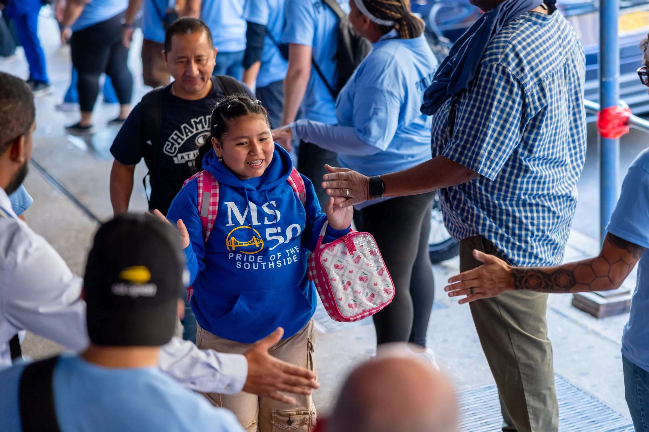 Students get high fives from parents