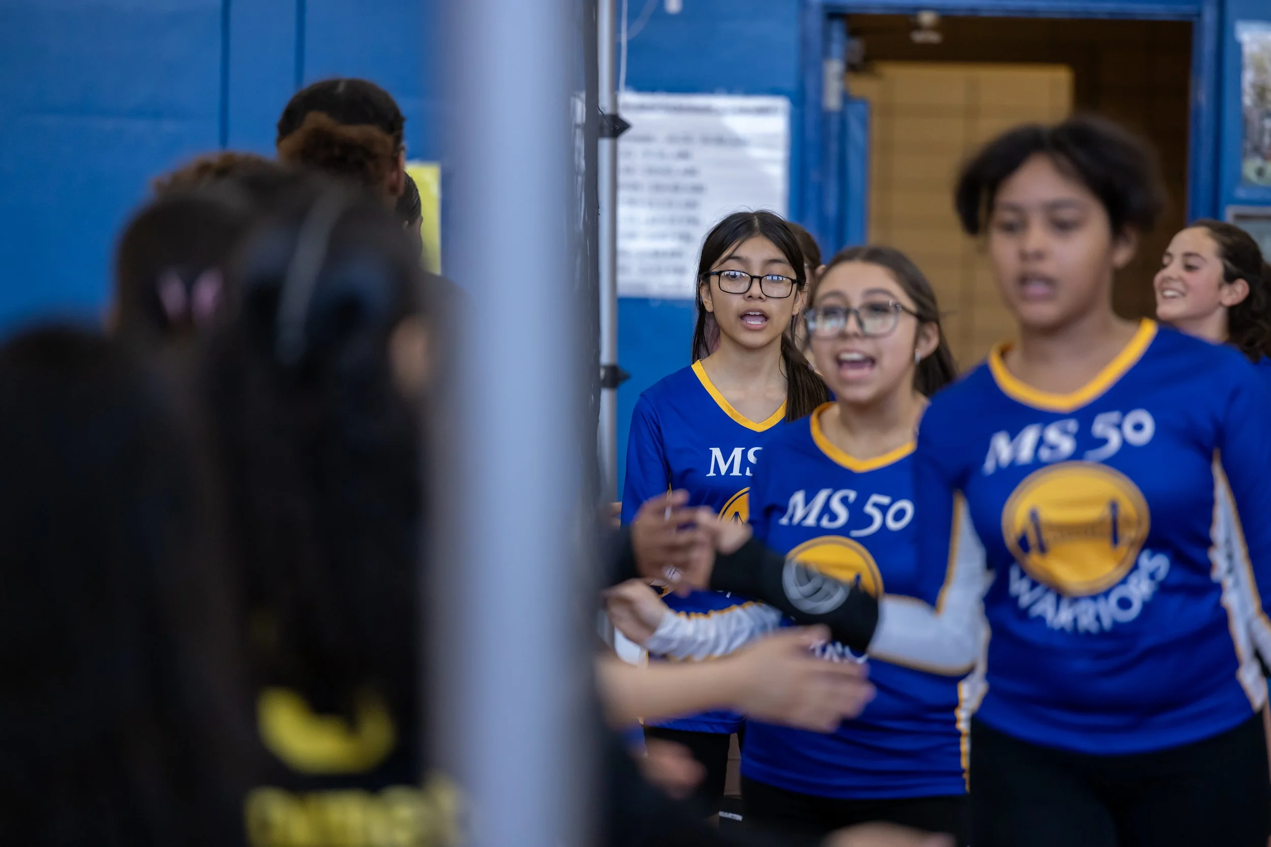 MS 50 students playing volleyball