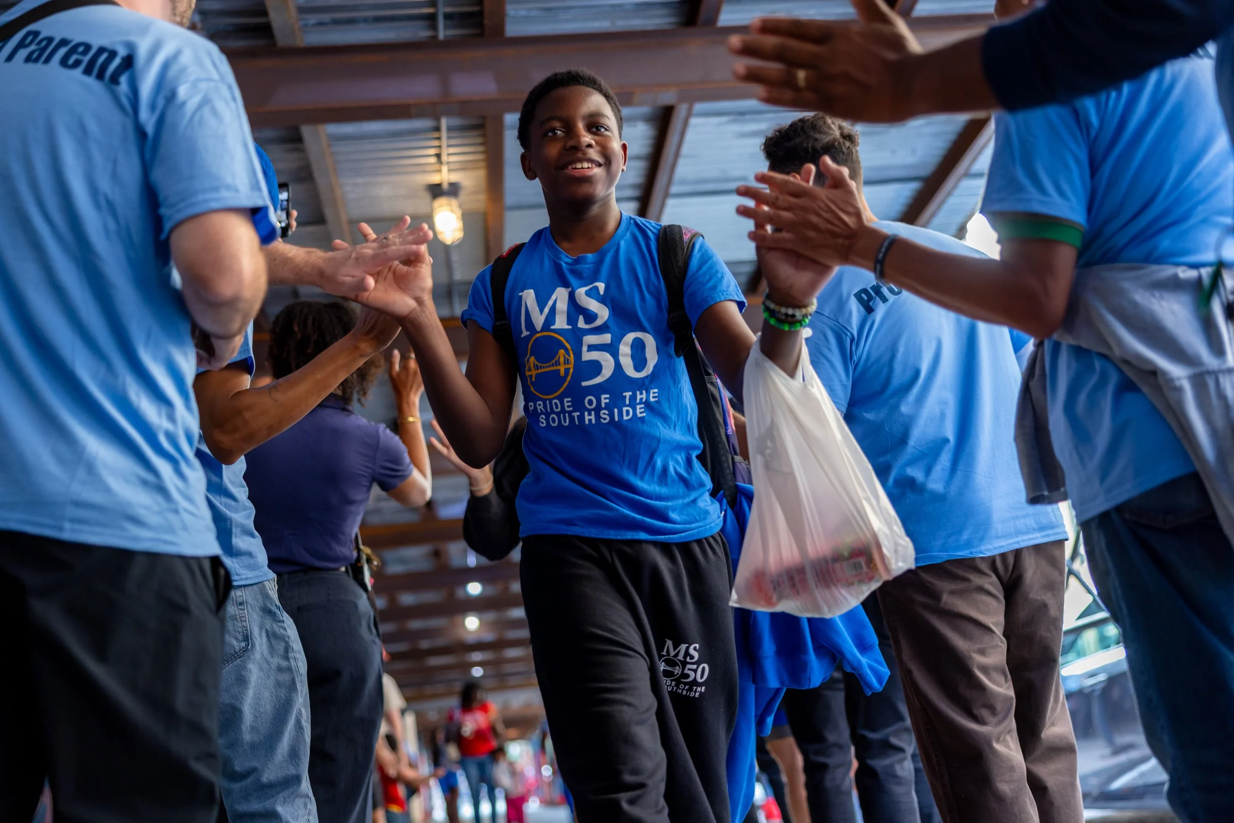 Students get high fives from parents