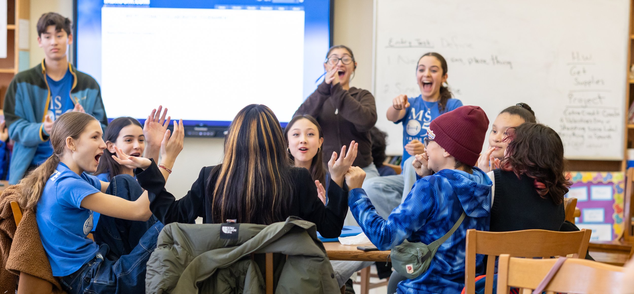 Debaters celebrate their wins