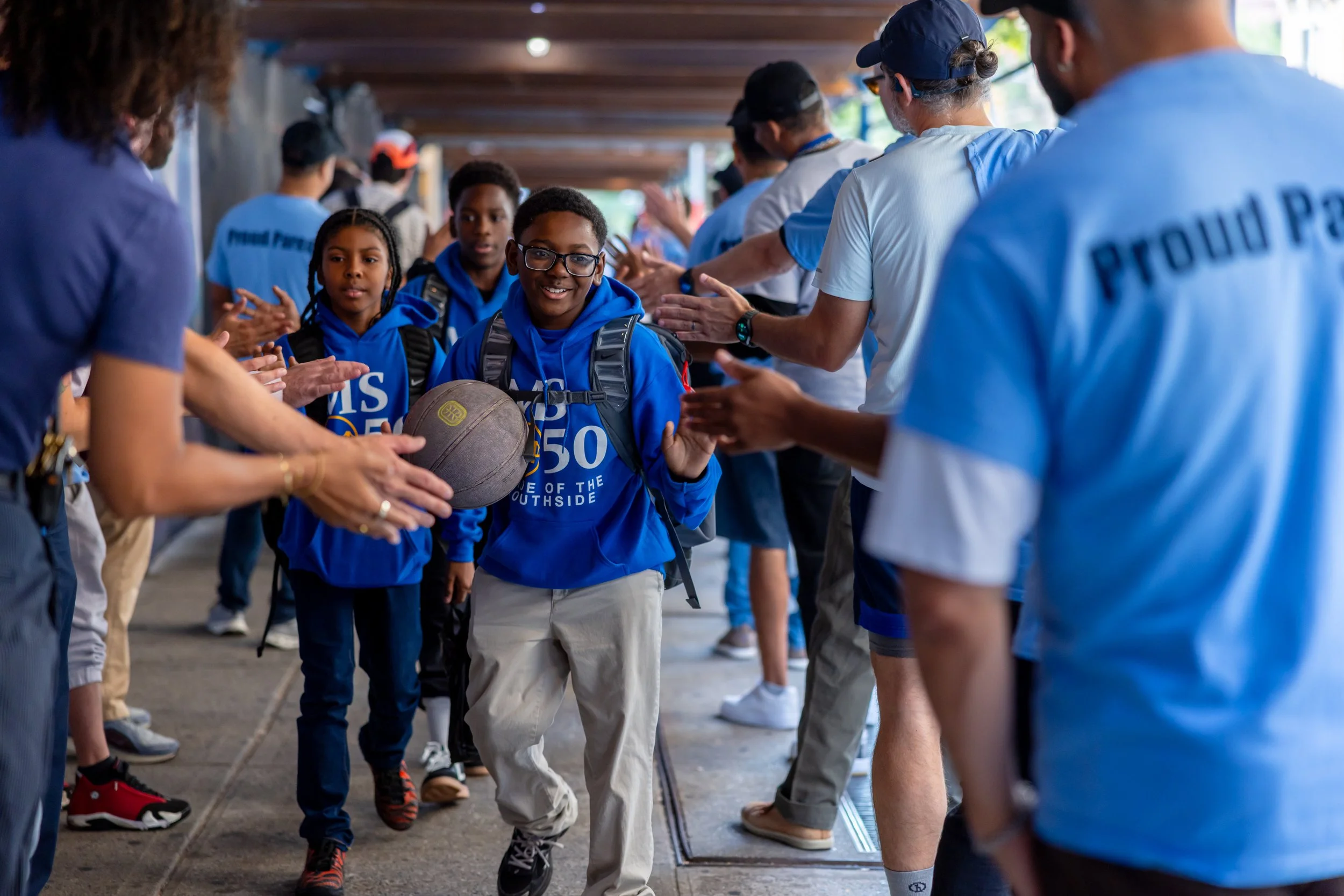 Students get high fives from parents