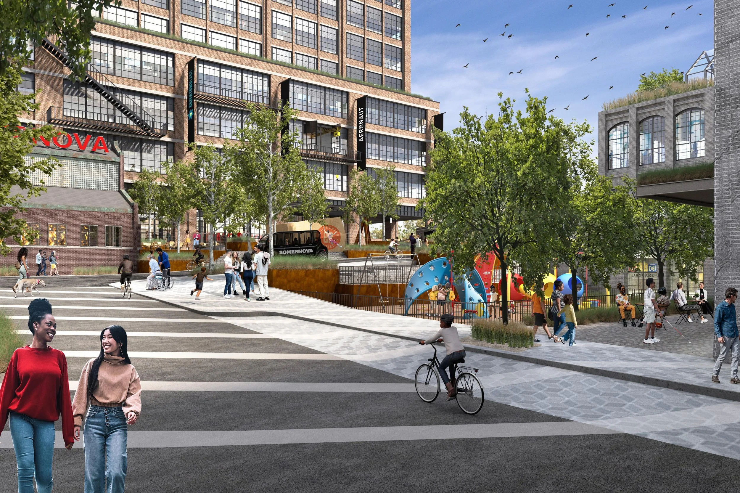 A bustling urban park scene with people walking, cycling, and playing. In the background, there is a tall modern brick building with large windows and artsy signs. Trees and greenery populate the area, and children are playing on a colorful playgroun
