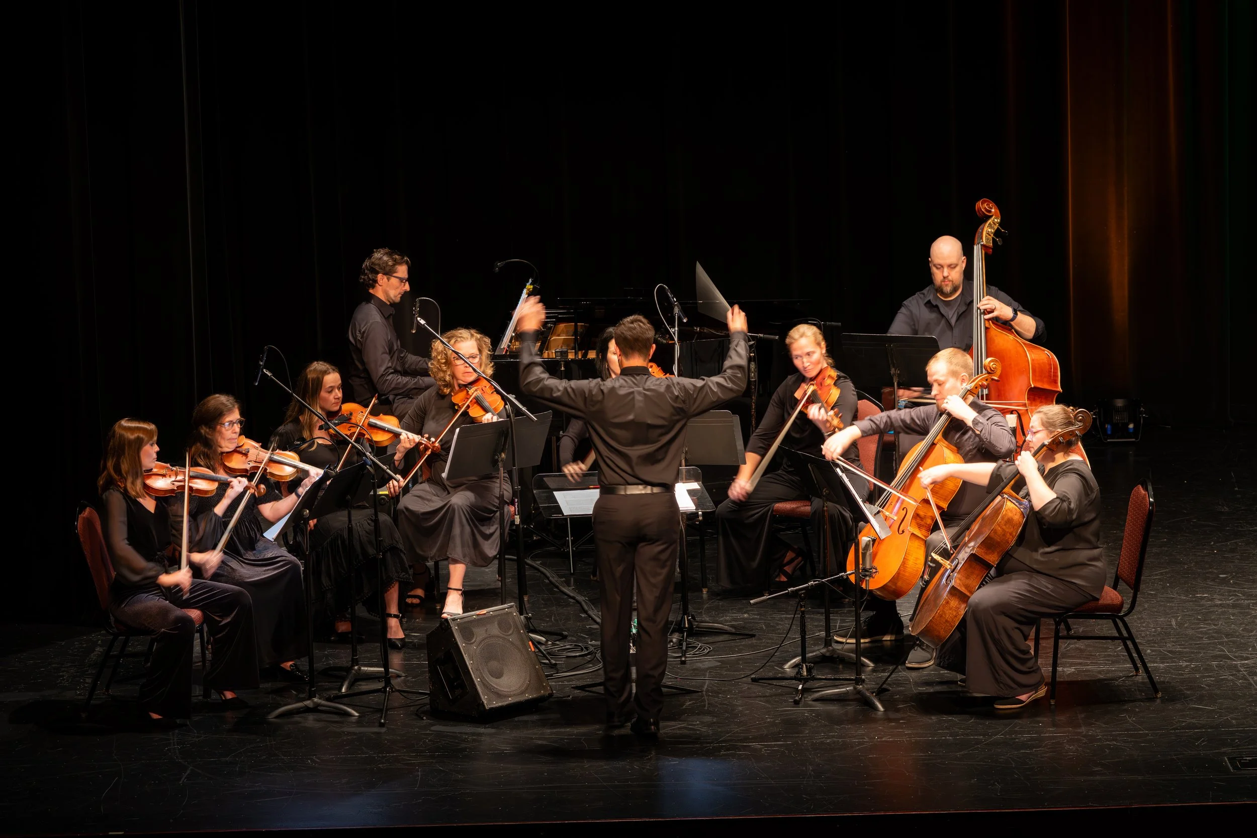 Composer David Getz conducts the Orchestra.