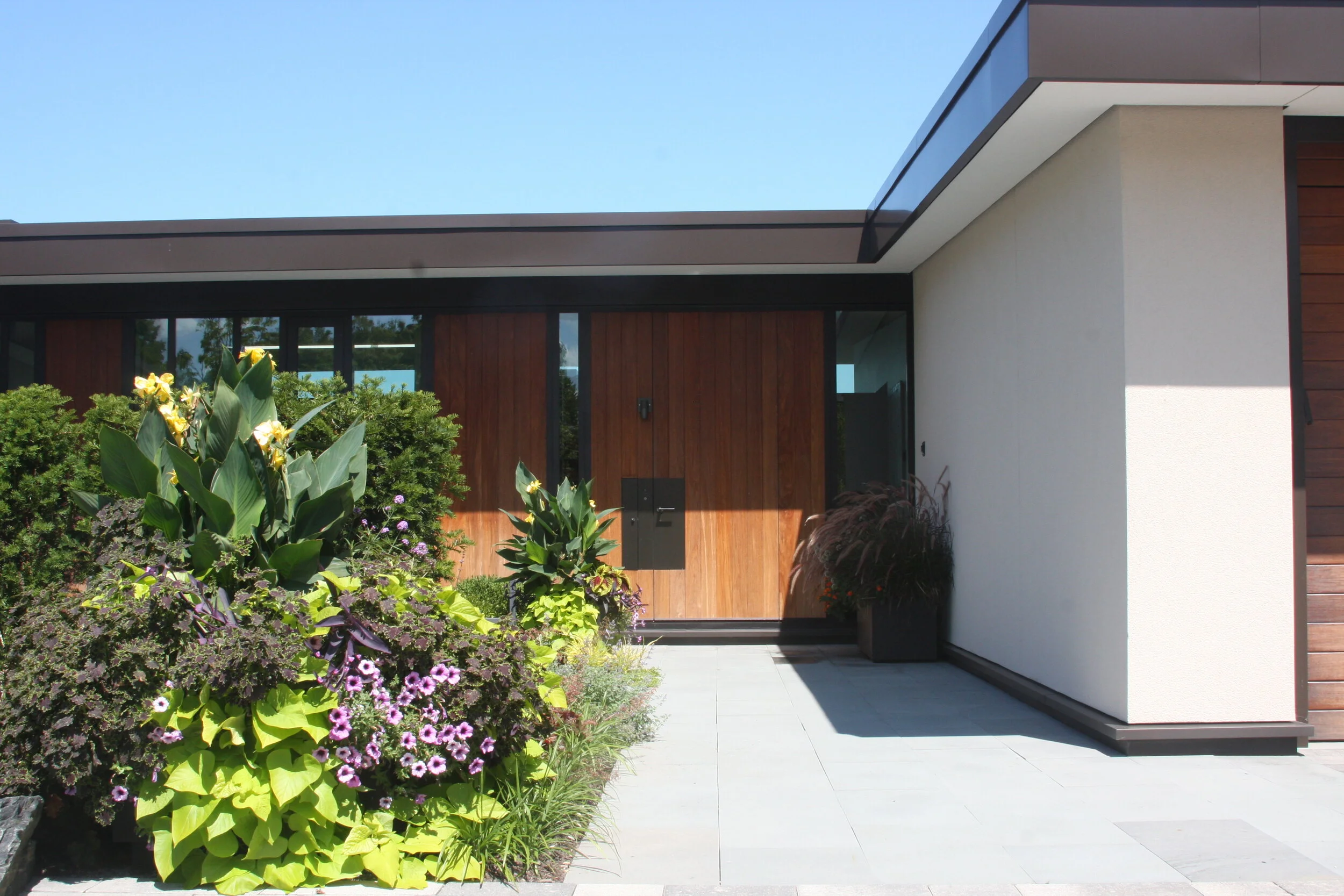 large residential highland park - entry way plantings