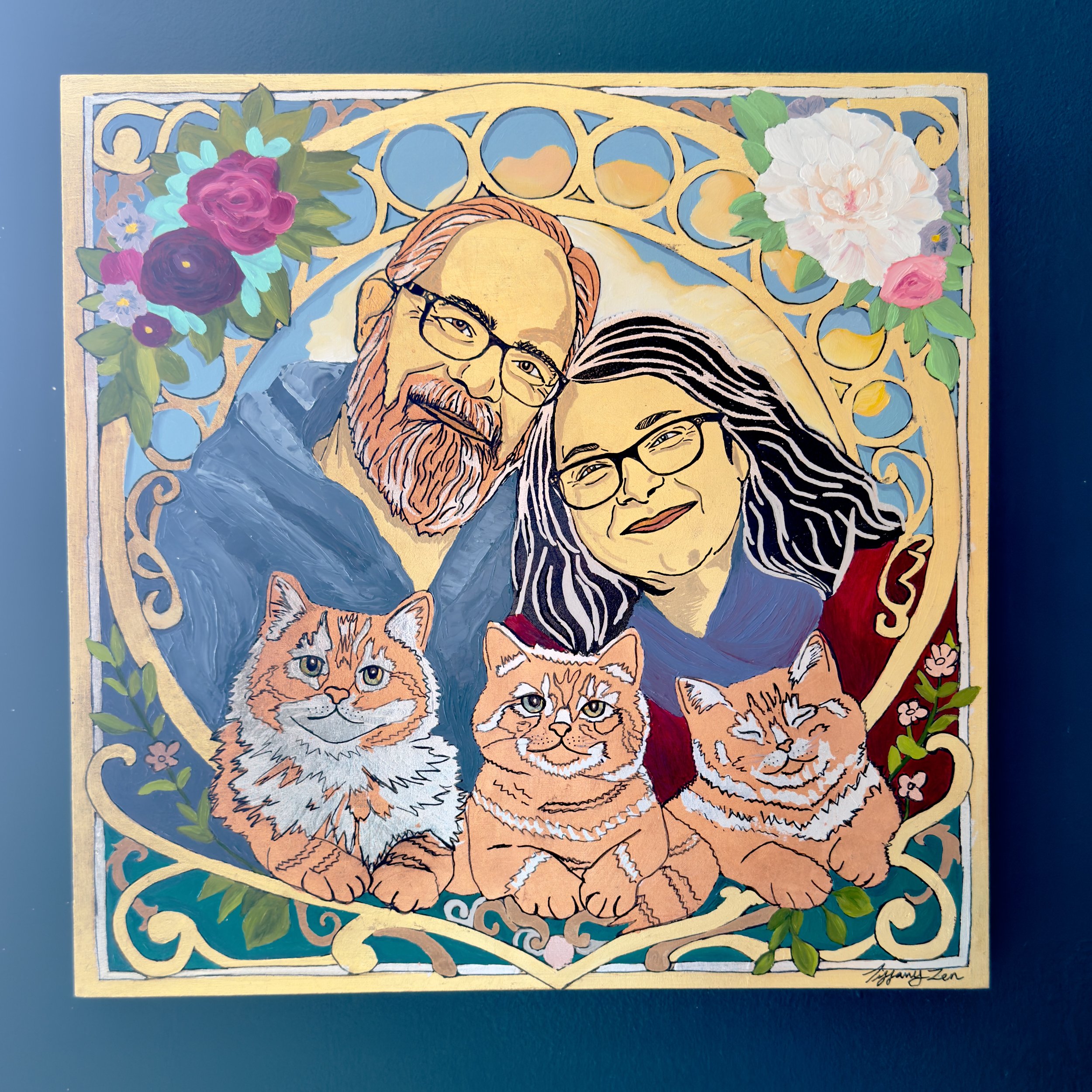 Colorful illustration of a smiling man with glasses and a beard and a woman with glasses and long dark hair, surrounded by four orange tabby cats and decorated with flowers and intricate patterns.