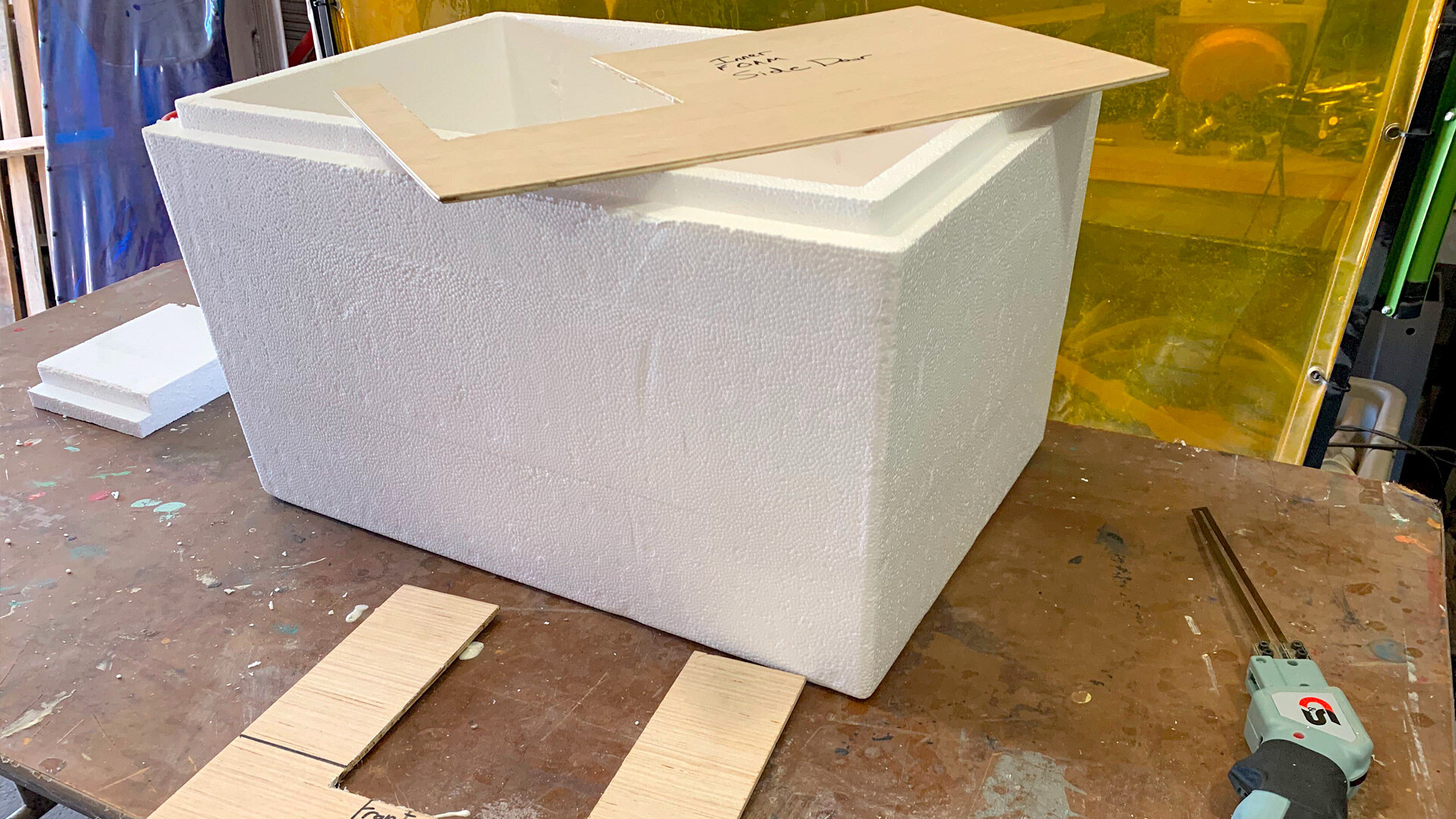  We made templates to be sure all of our door openings landed in the right places and made short work of the Styrofoam using heated foam carving knives. We also tested an electric carving knife and that worked, but it was not really as efficient for 