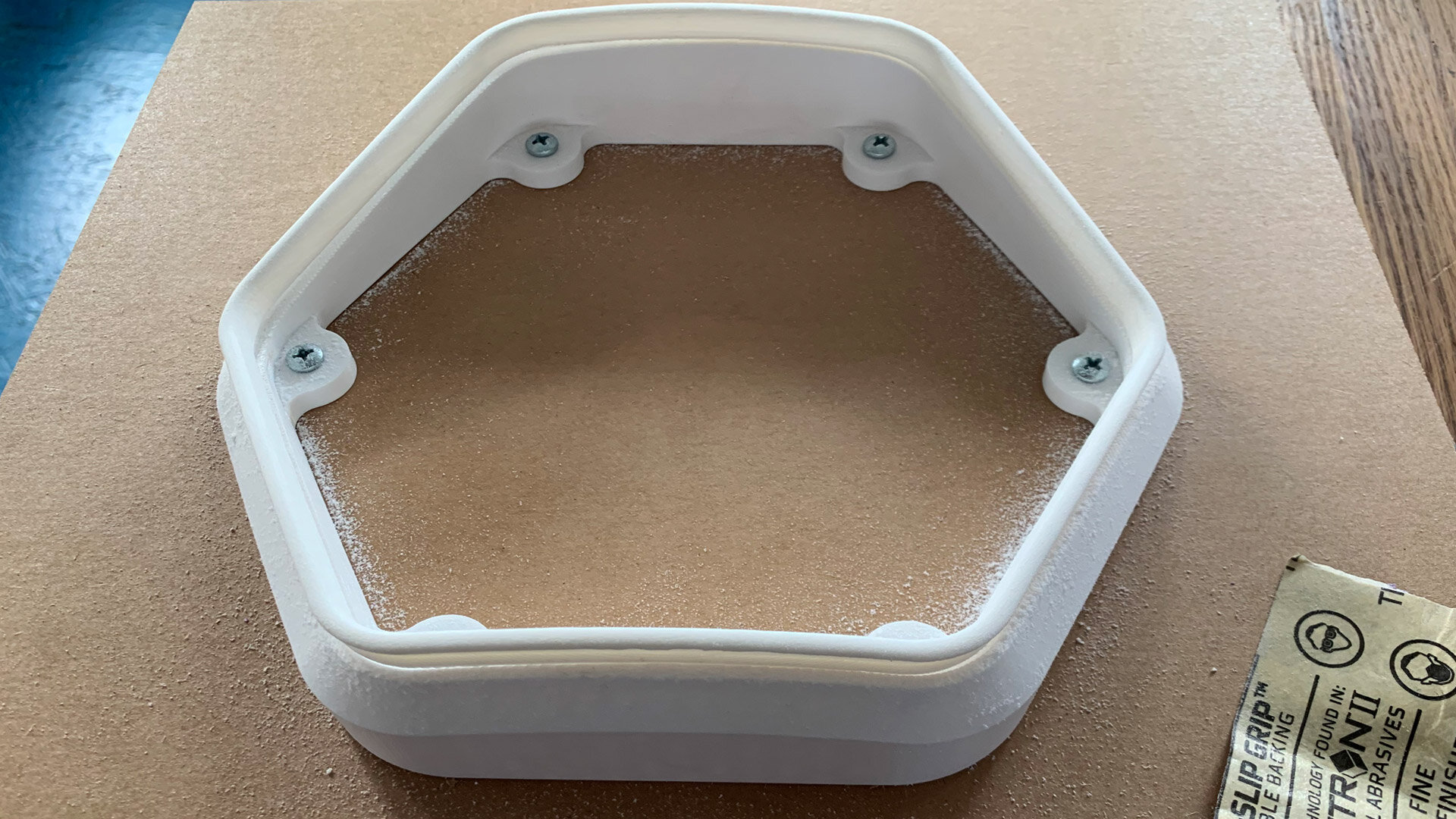 After printing, every door frame was snapped into a holding jig for a final sanding pass. The secret truth of 3D printed parts is that they usually require human clean up to make them look great. We will definitely be exploring injection molding for