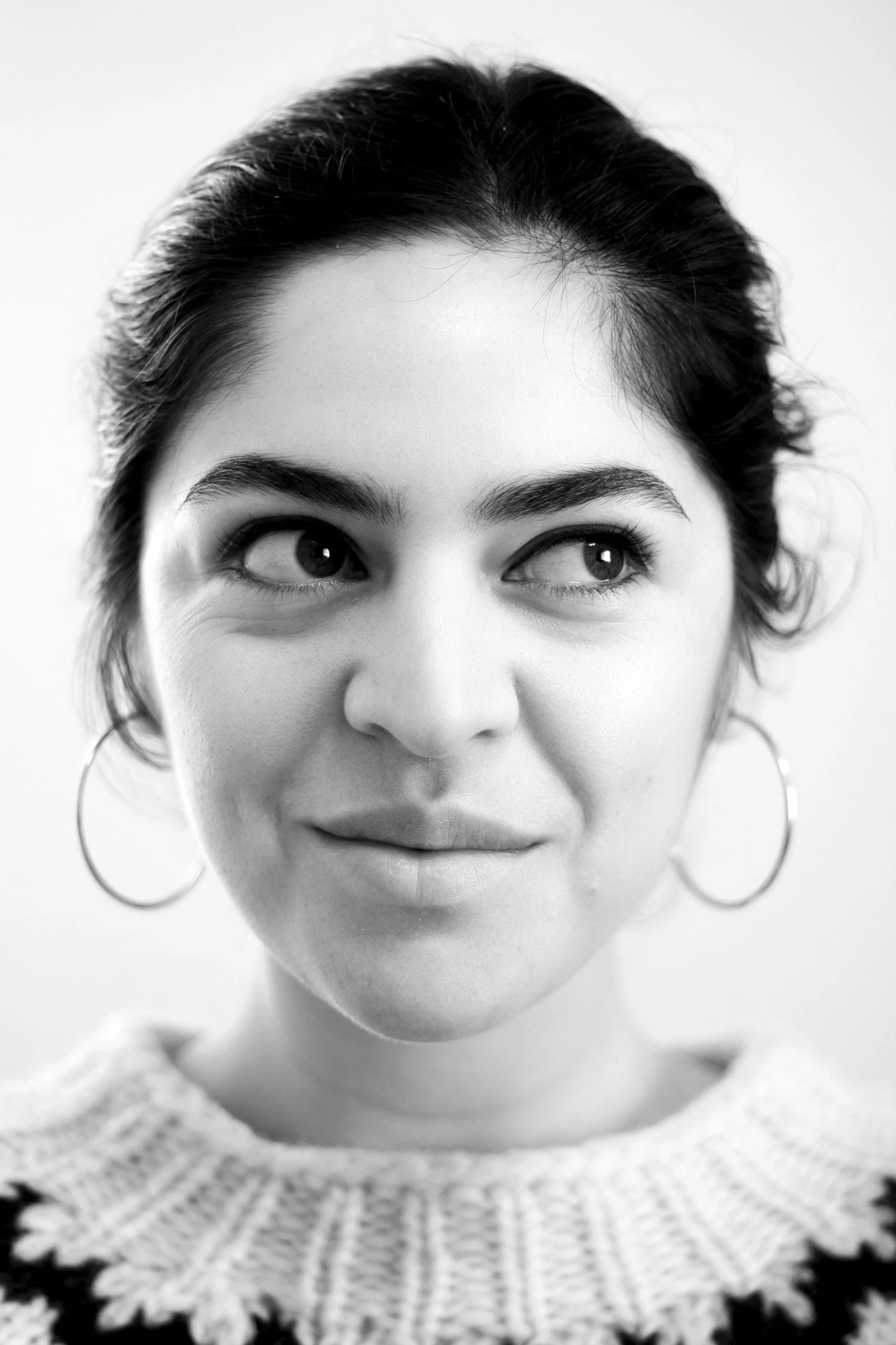 Black and white photo of a woman looking away from camera.