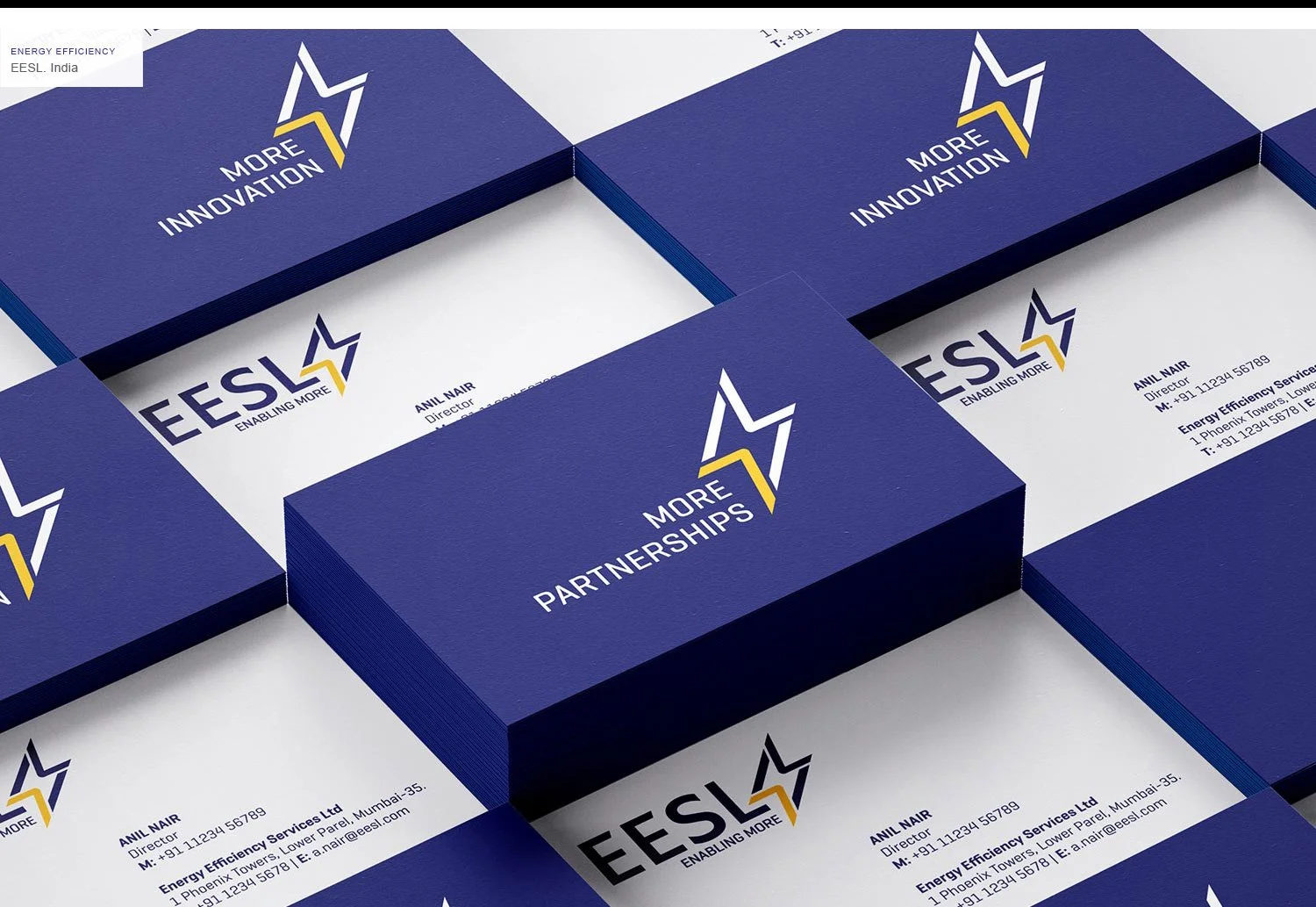 Business cards for ESL, an energy efficiency company, arranged in a grid. The cards are blue with white and yellow accents, featuring the ESL logo, the tagline "Enabling More," and contact information for Anil Nair, the director.