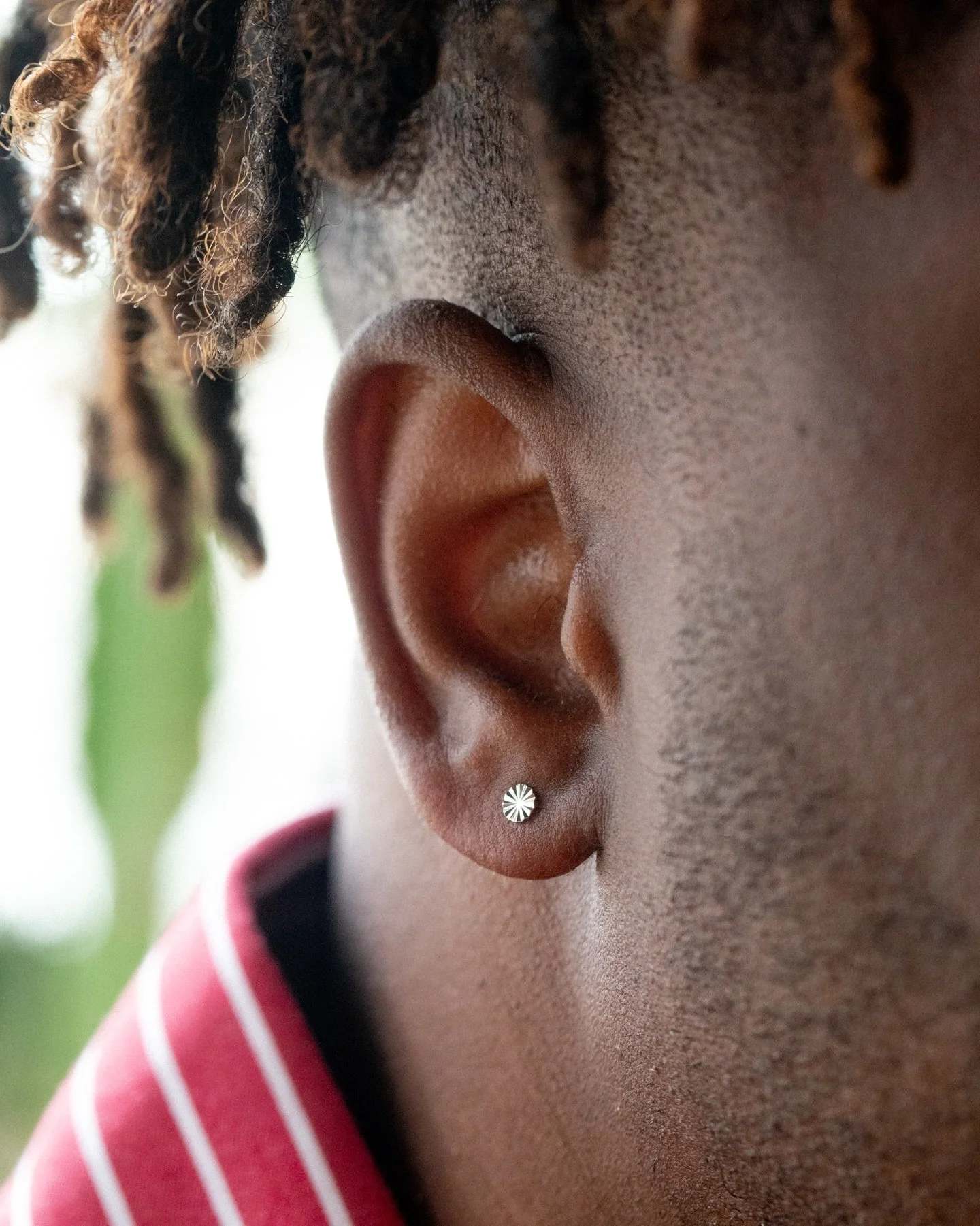@stabnpokesbyadriana gave @mightycasual his first earlobe piercings! 

Schedule an appointment with our beloved Adriana for apprenticeship pricing while you still can! 

We also LOVE these Spline disks from @neometaljewelry! They add so much shine wh