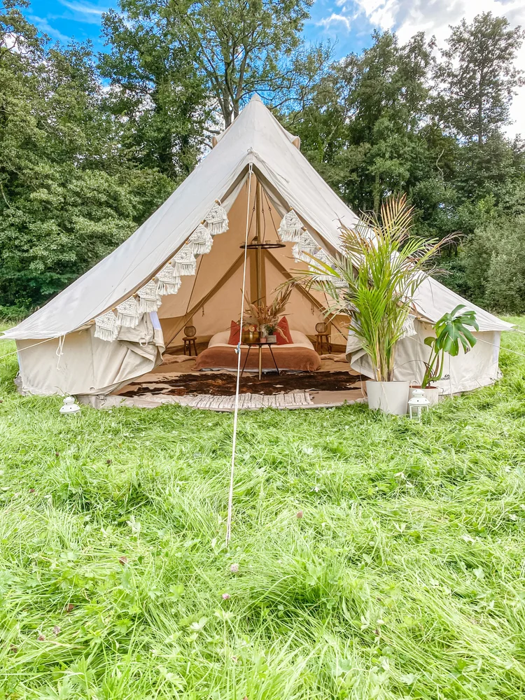 A cosy Blank Canvas bell tent styled for a celebration