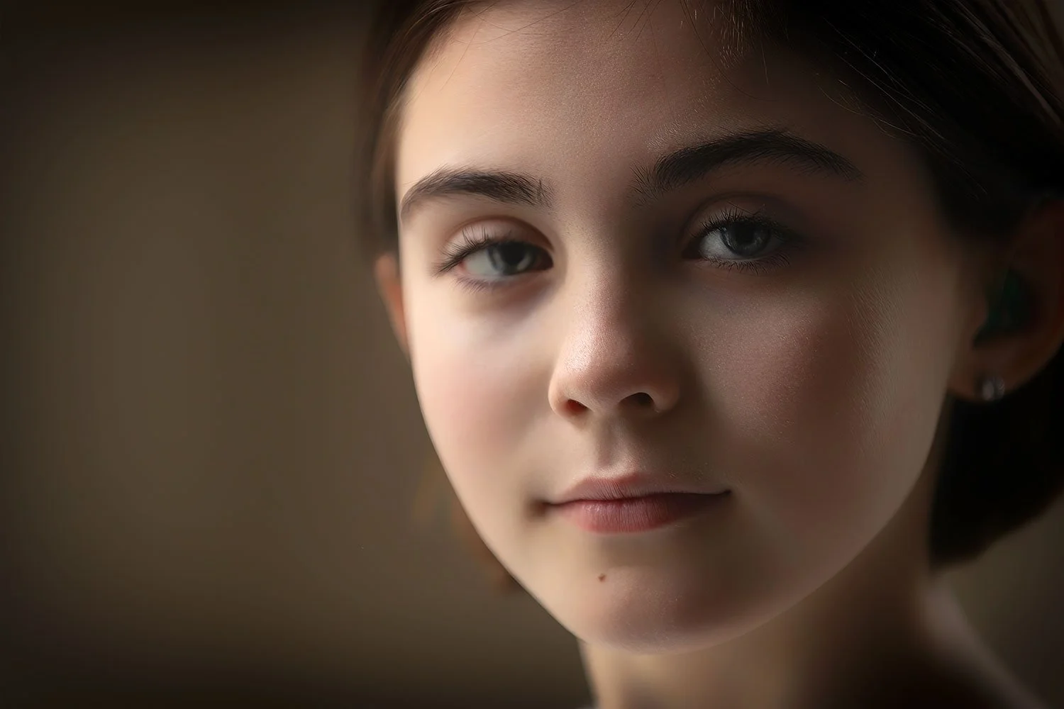 closeup of pretty girl looking at camera with natural window light