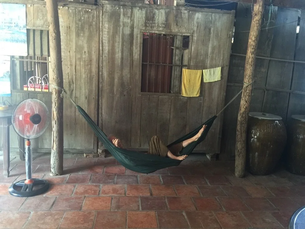 Resting in a hammock in a wooden house