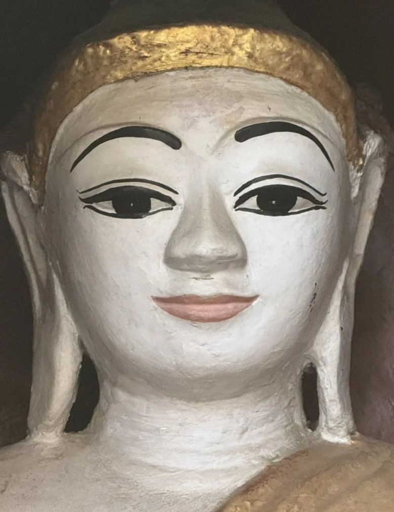 Painted Buddha face in a temple in Myanmar